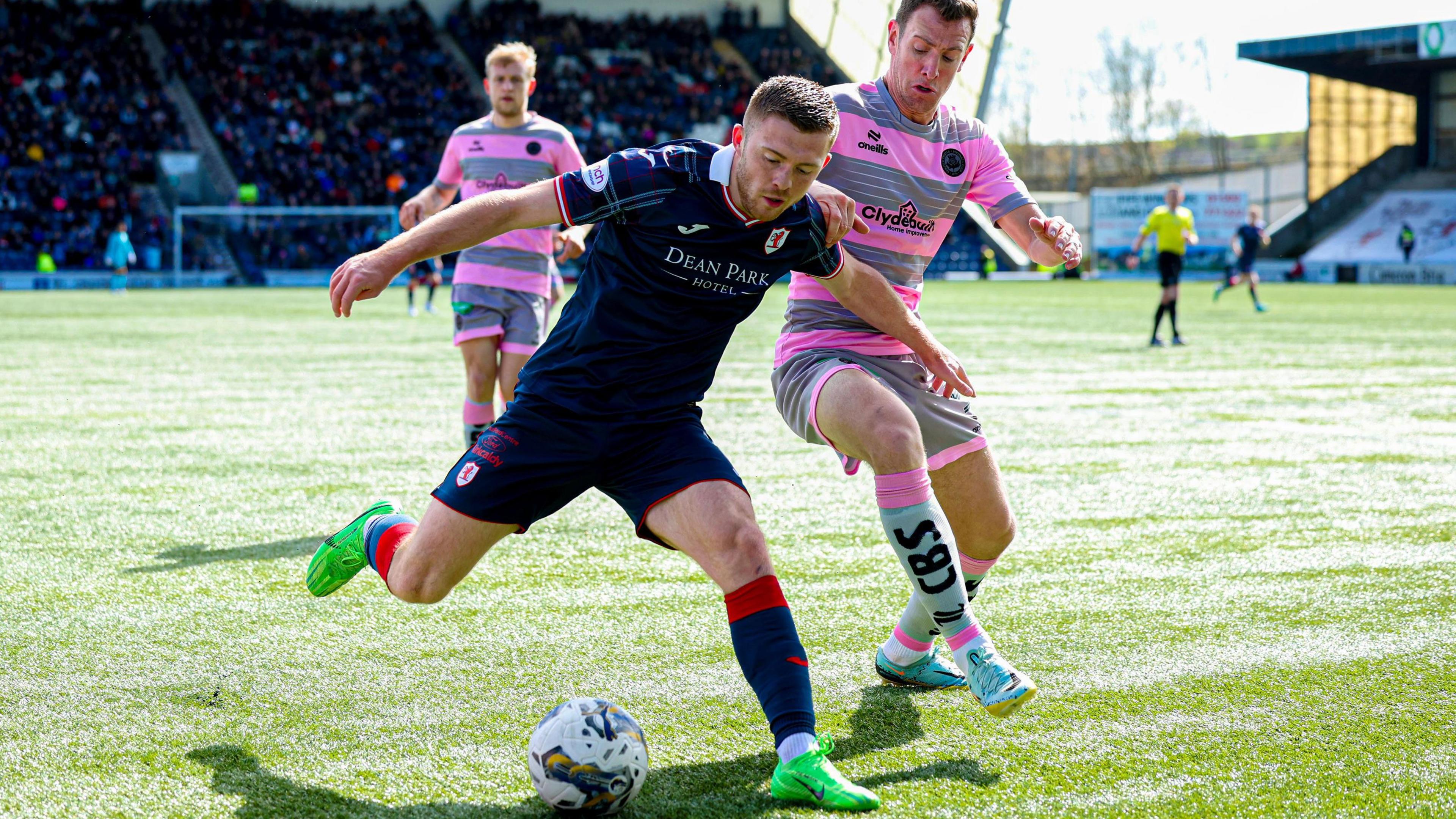 Partick Thistle and Raith Rovers players challenge for the ball