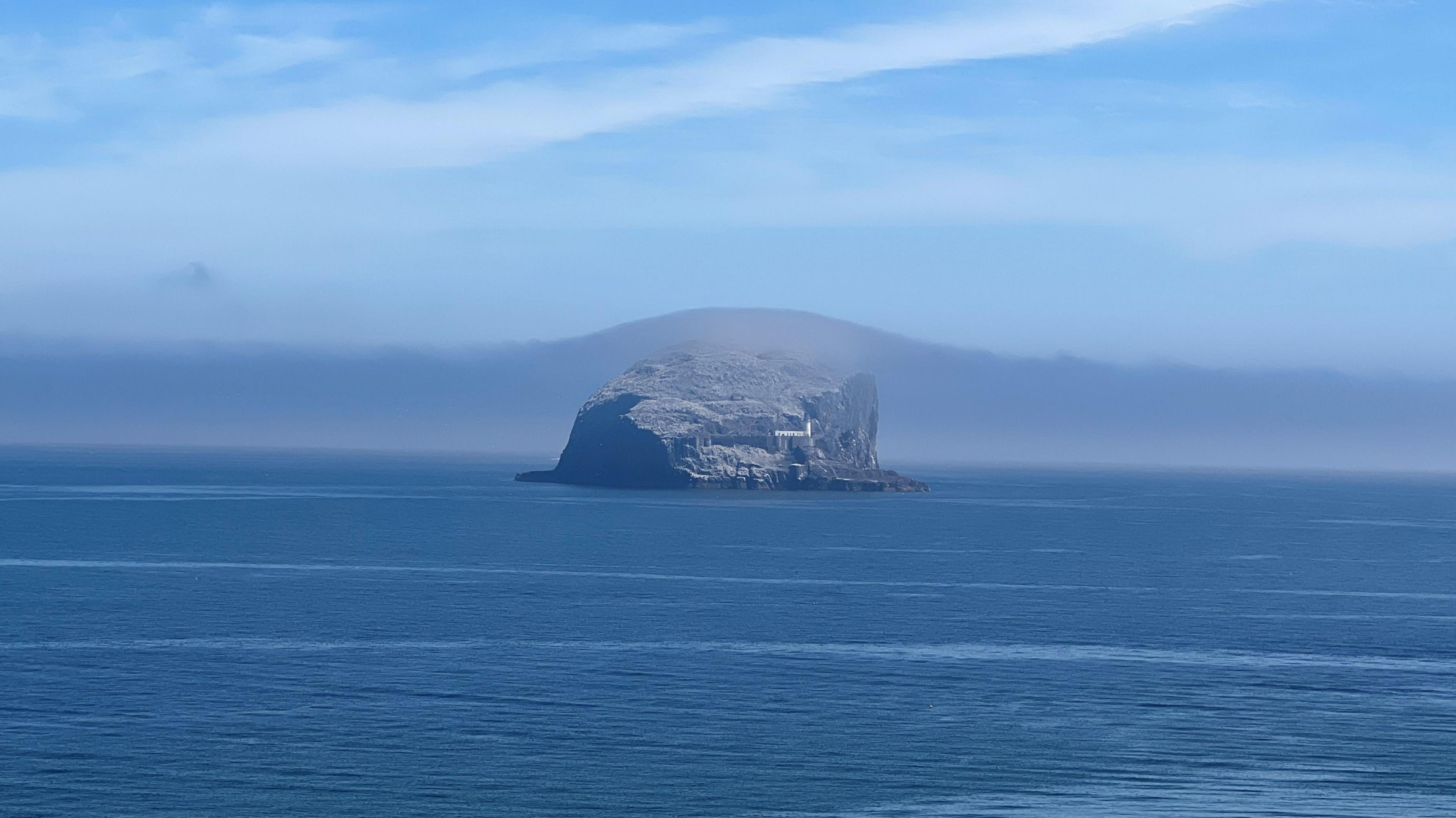An island with mist starting to settle over it