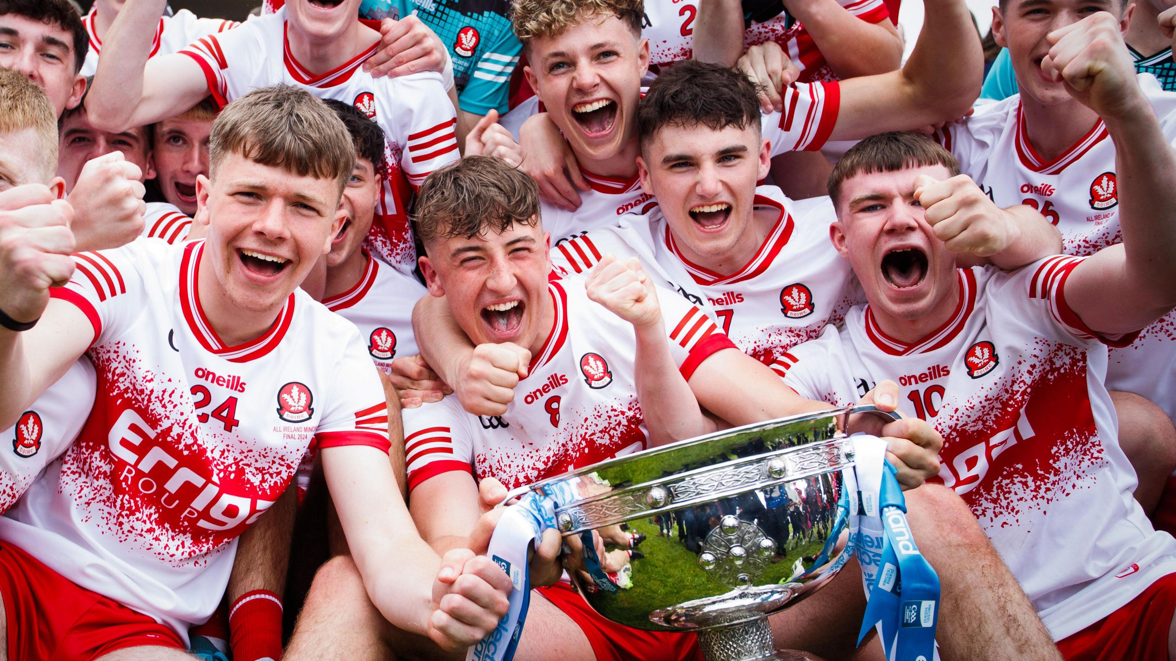 Derry's minor champions celebrate with the Tom Markham Cup