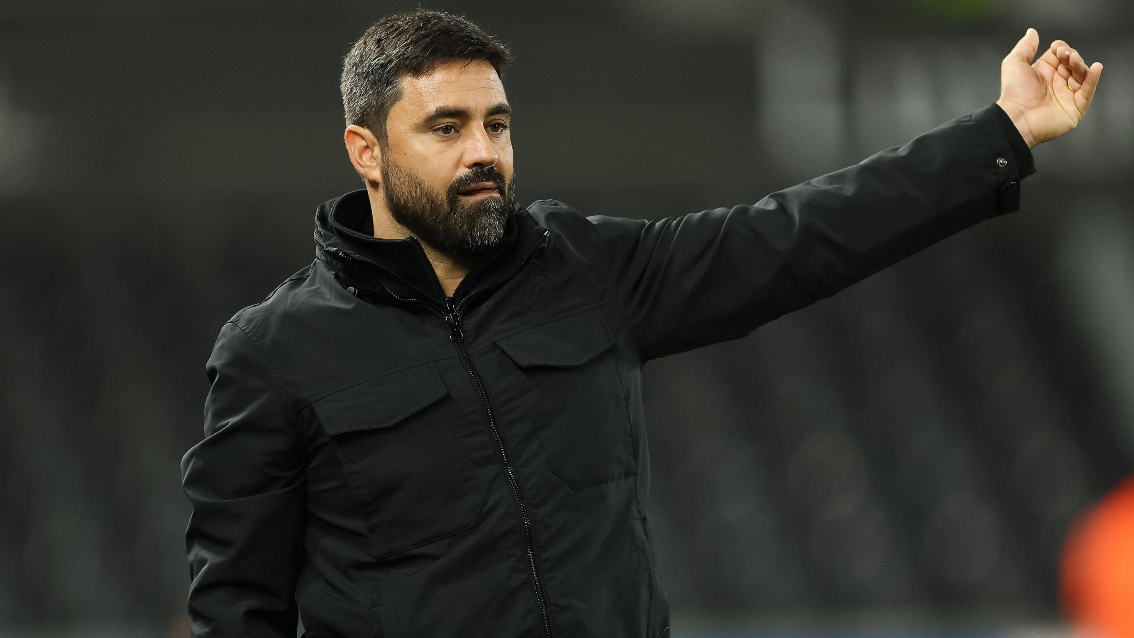 Vitor Matos with an arm outstretched