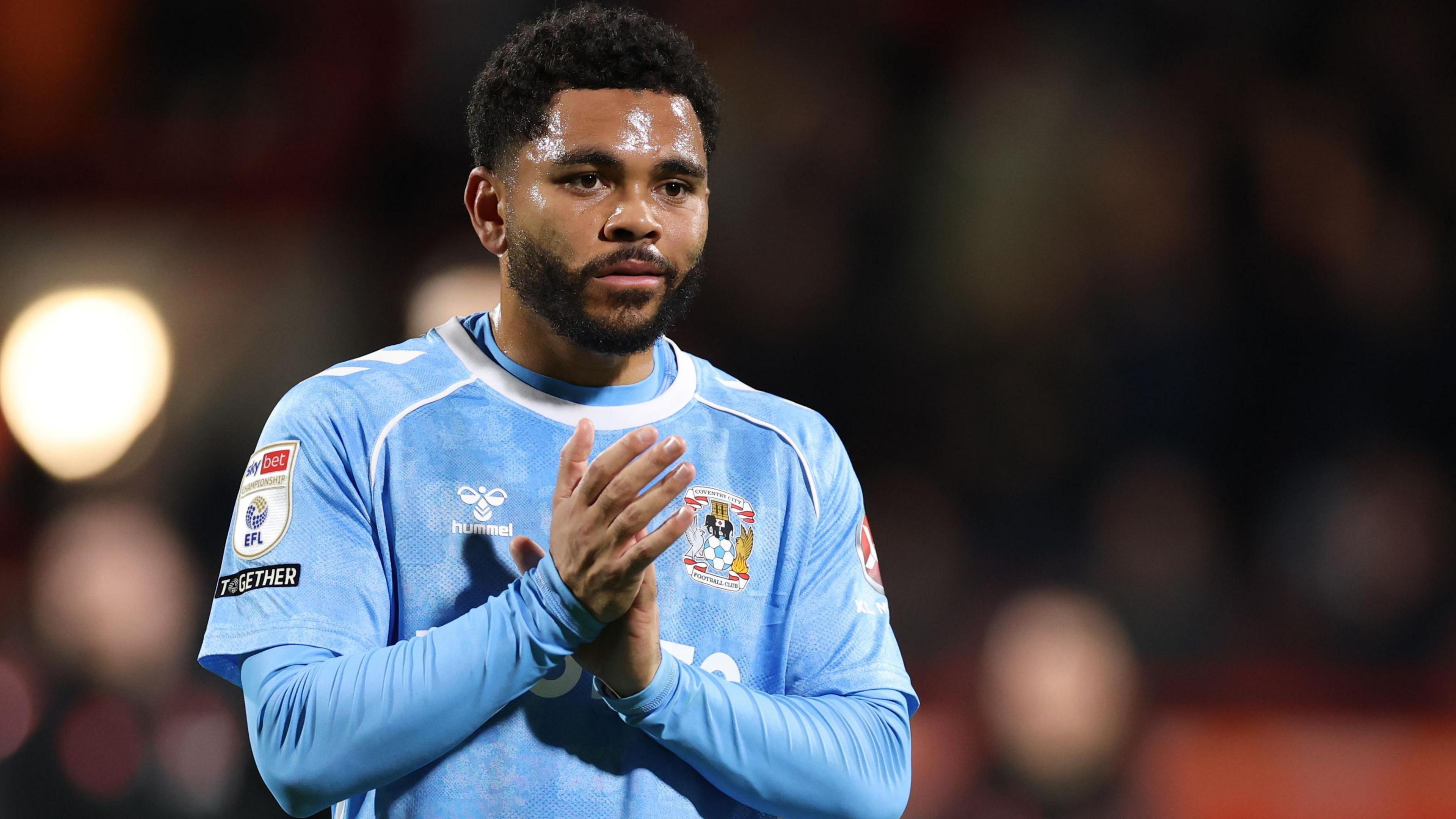 Jay Dasilva claps the crowd after a game for Coventry City