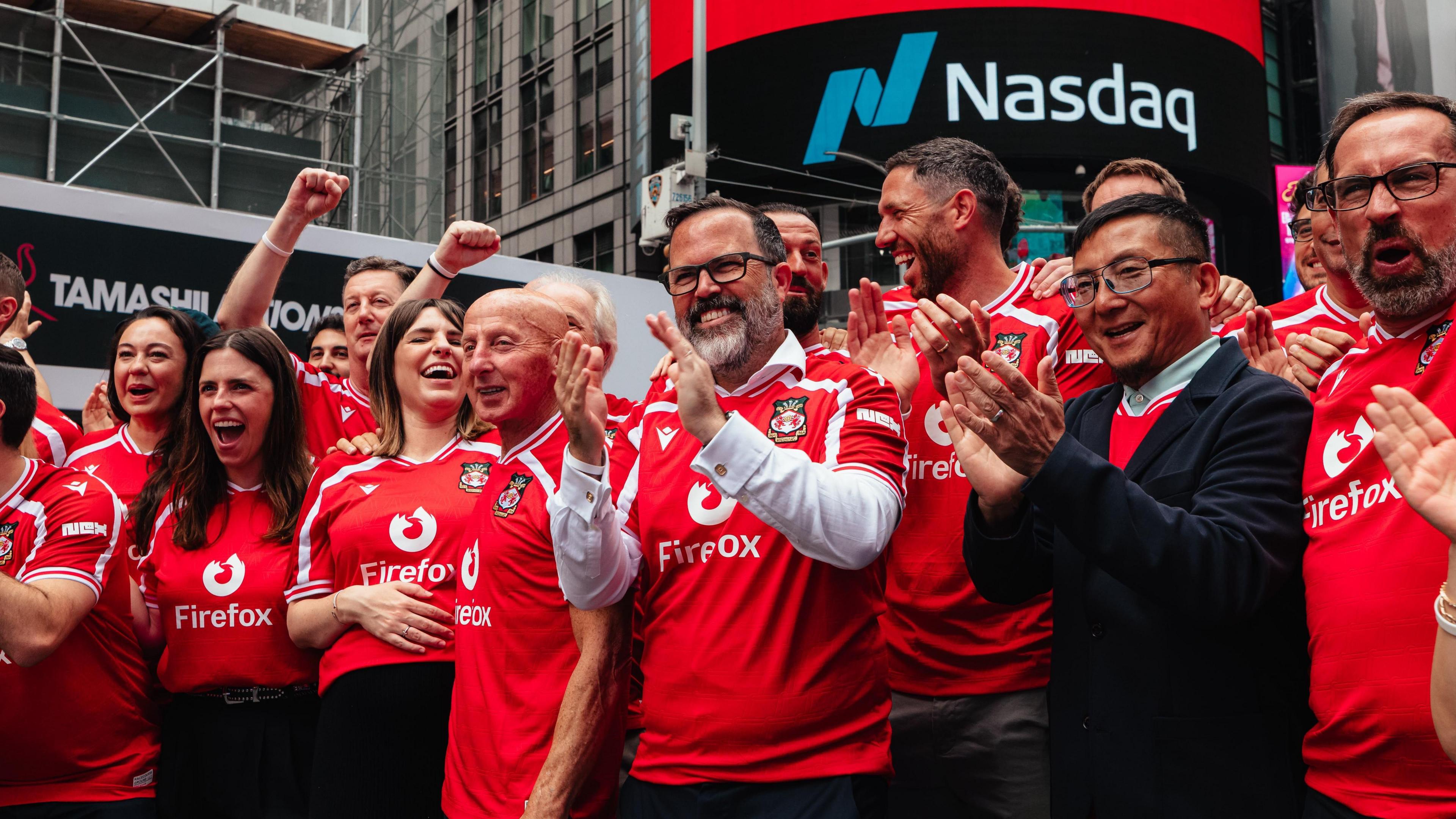Wrexham CEO Michael Williamson with former Wrexham players Mickey Thomas and Ben Tozer along with staff and fans in New York