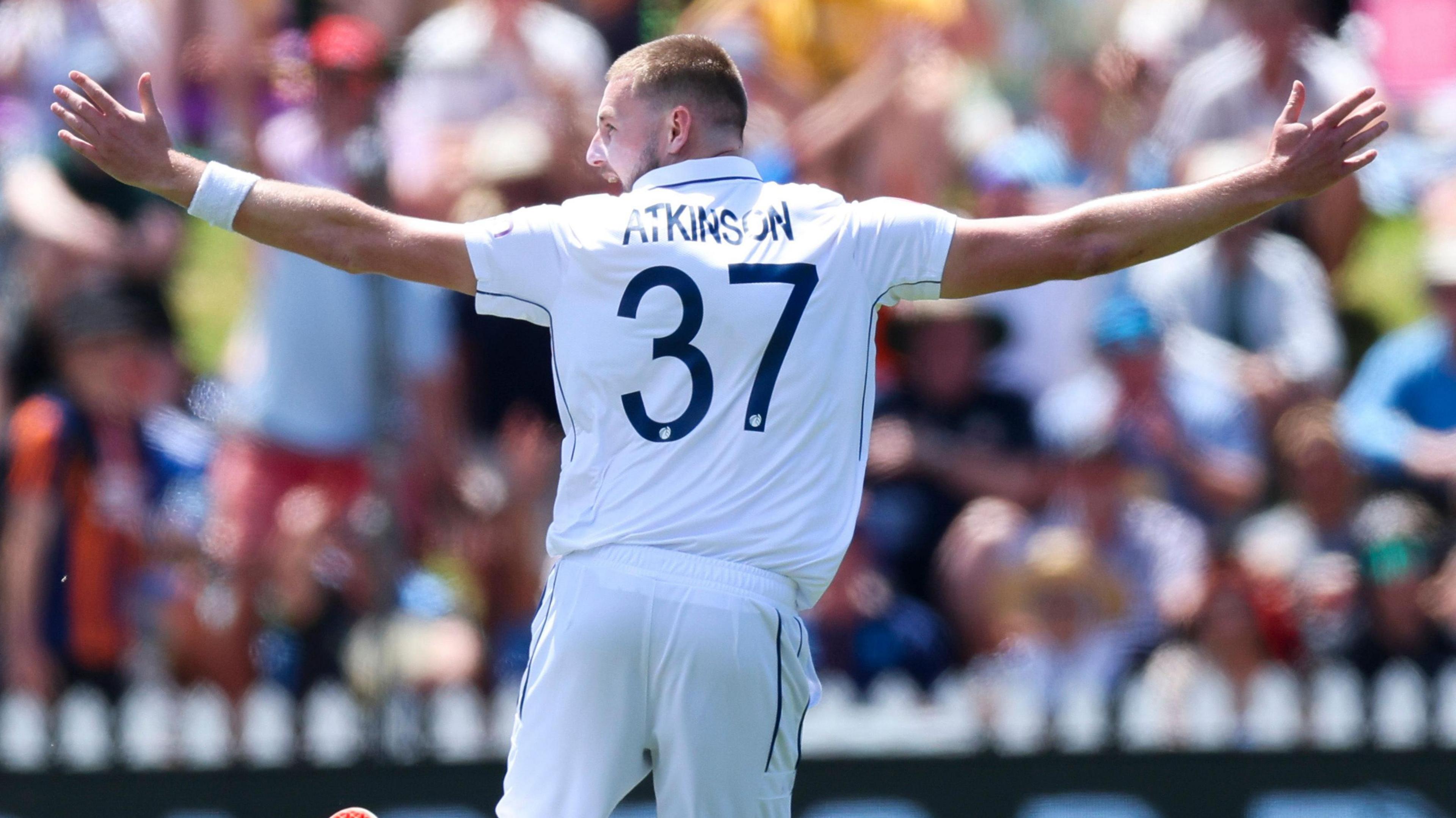 Gus Atkinson celebrates taking a hat-trick against New Zealand