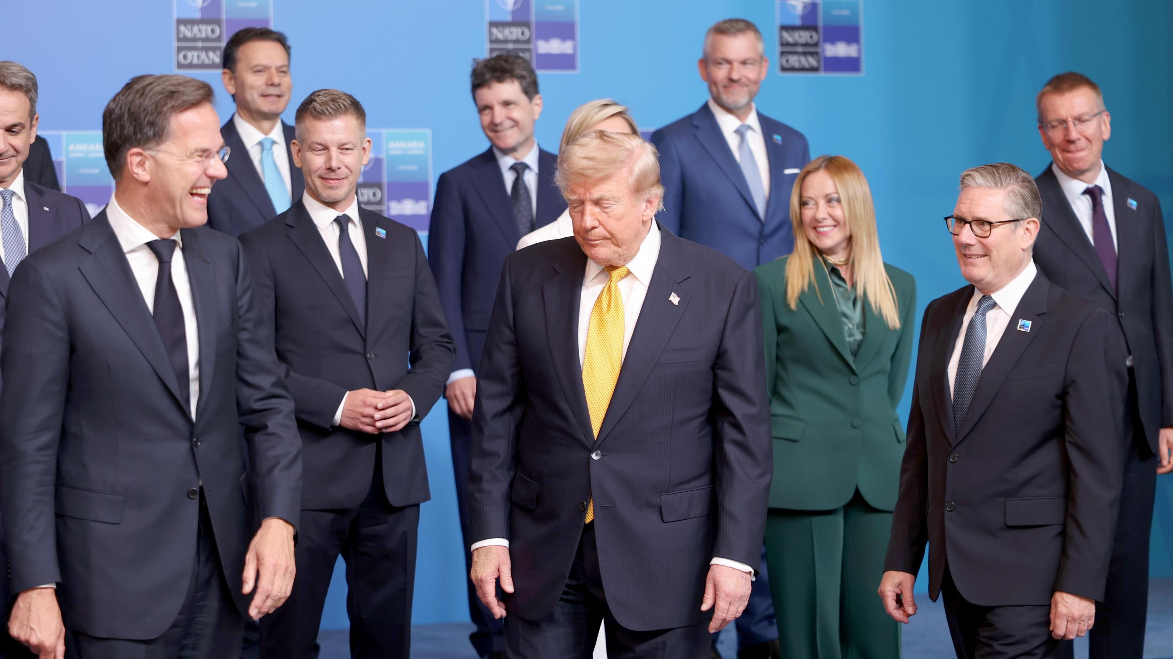 Nato Secretary General Mark Rutte (L) laughs with other Nato leaders including Hungarian PM Peter Magyar, President Trump, Italian PM Georgia Meloni and UK PM Keir Starmer.