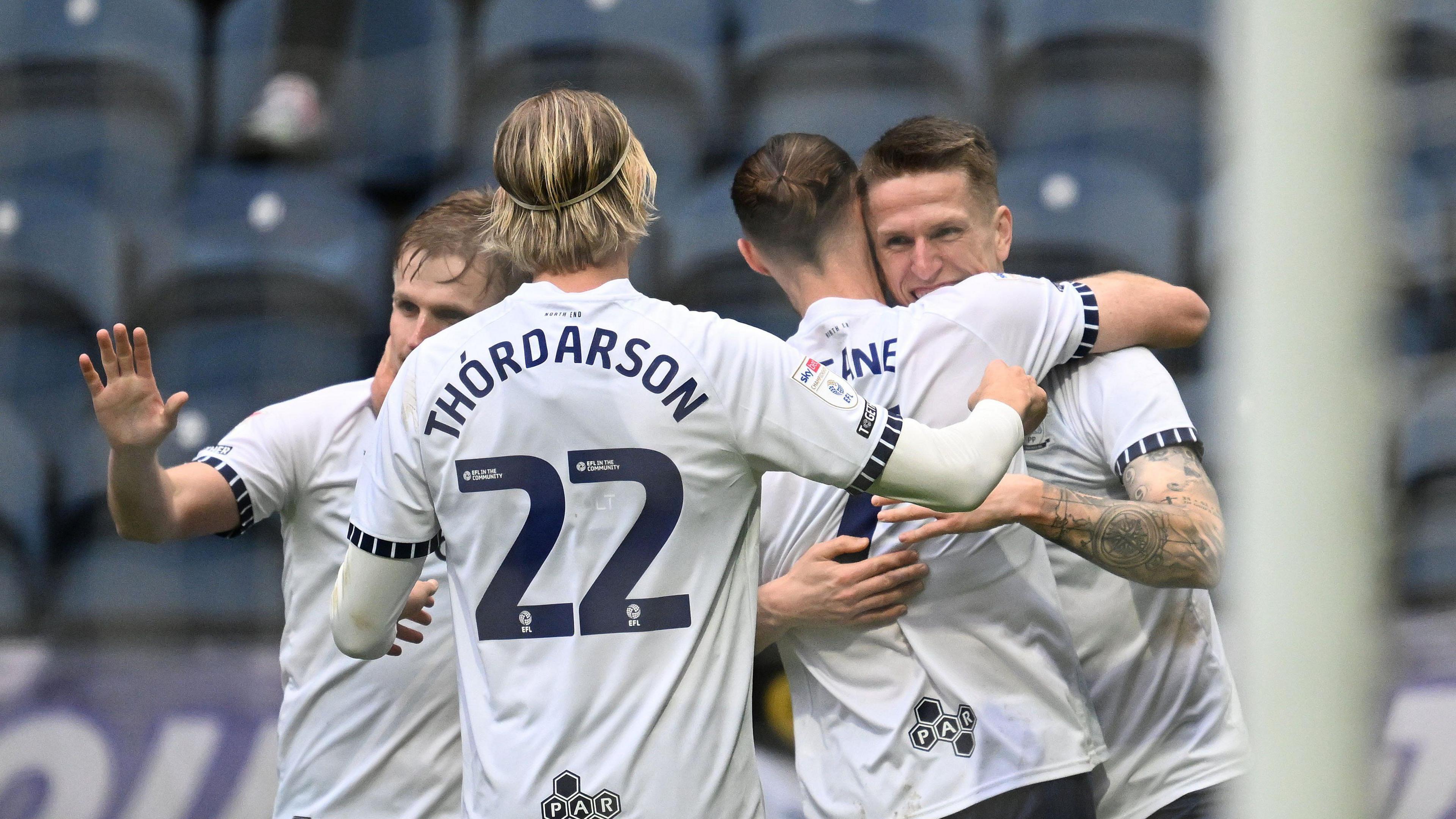 Emil Riis celebrates with teammates after scoring his first goal