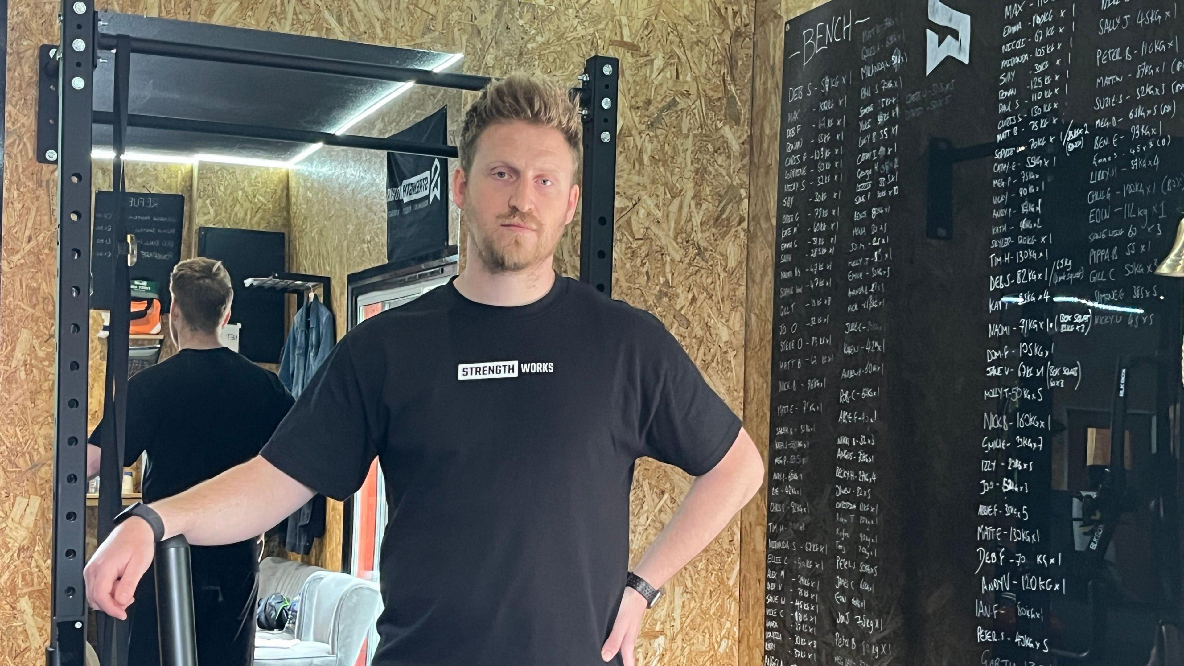 Craig Marrison stands inside Strengthworks gym