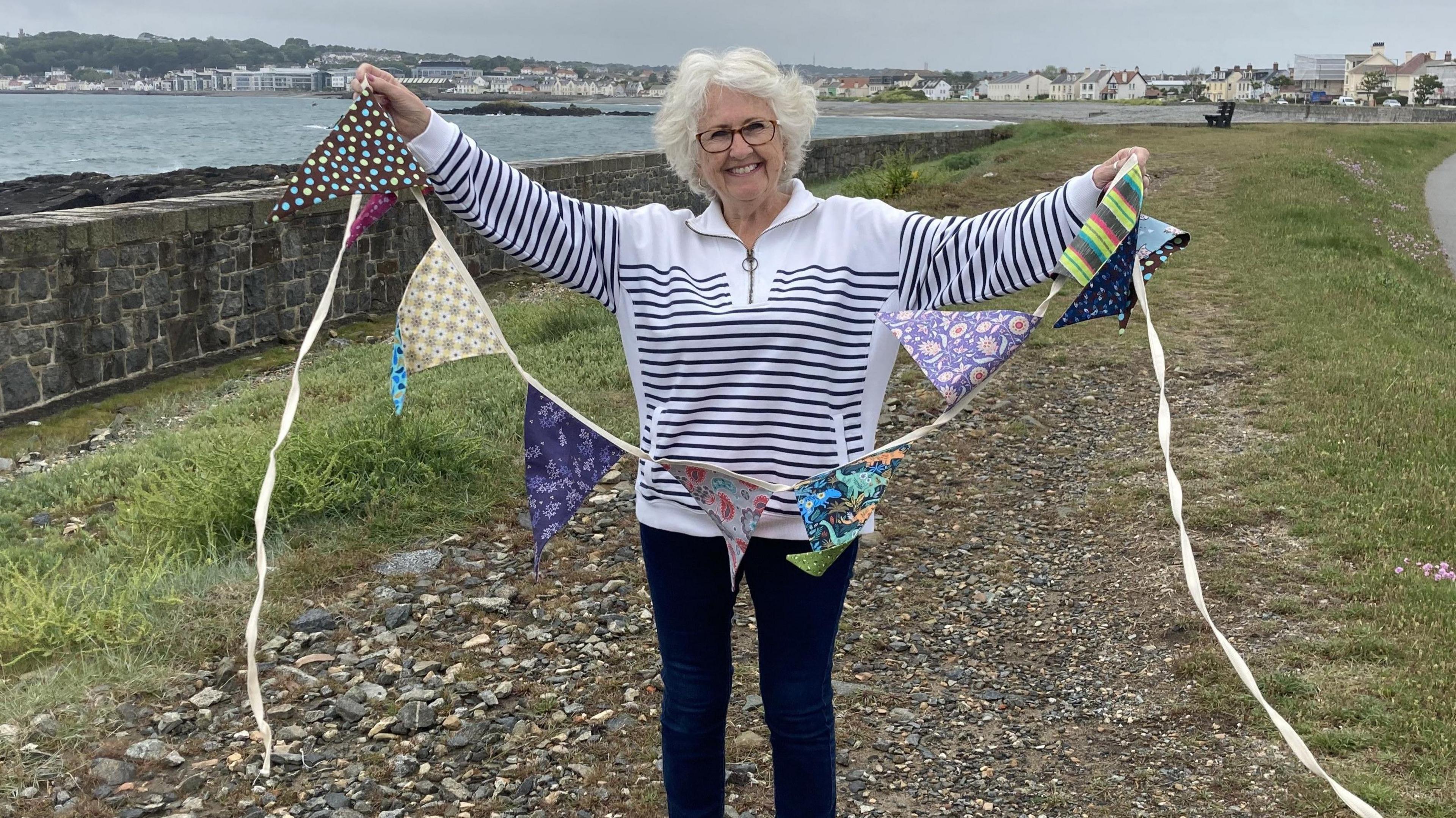 Megs Bailey holds up some bunting