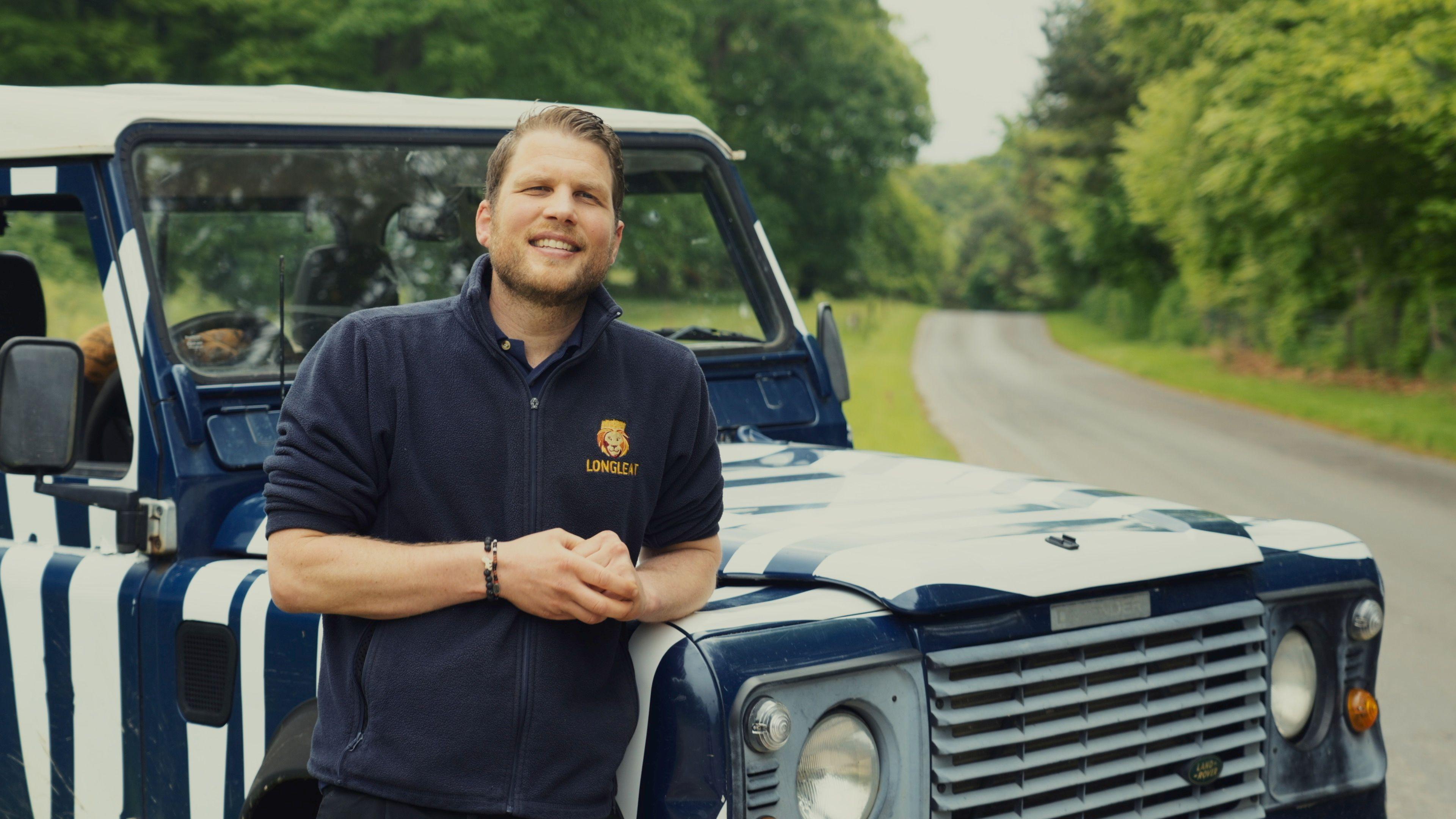 A man leaning on a truck 