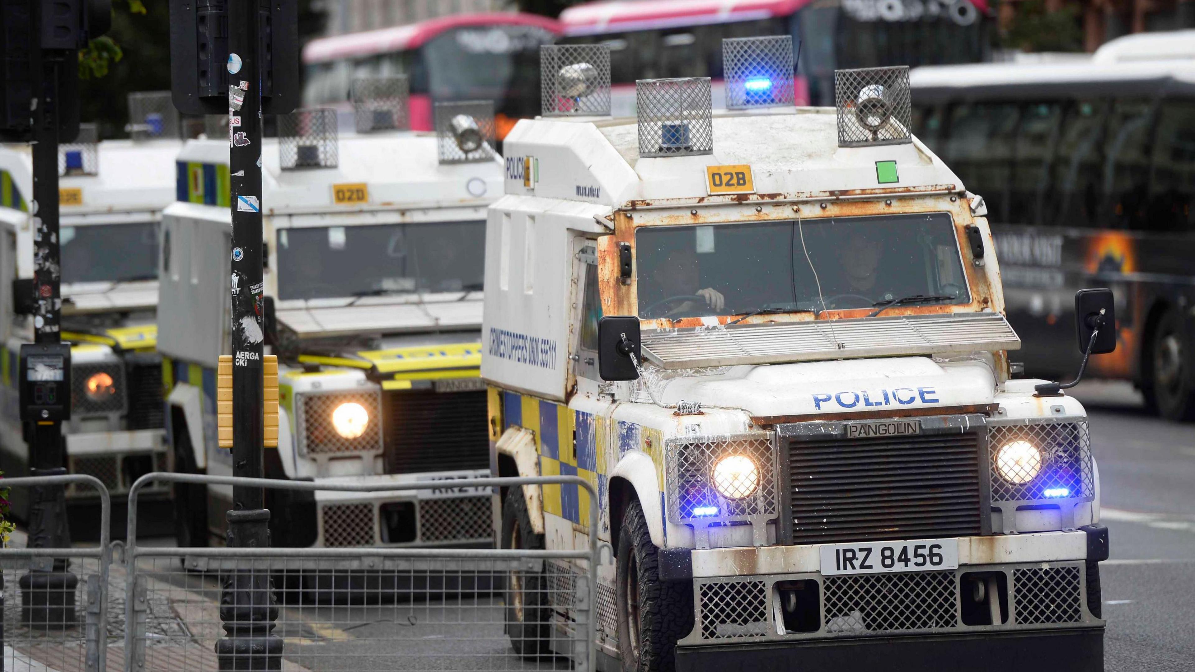 Police land rovers parked outside City Hall Belfast 