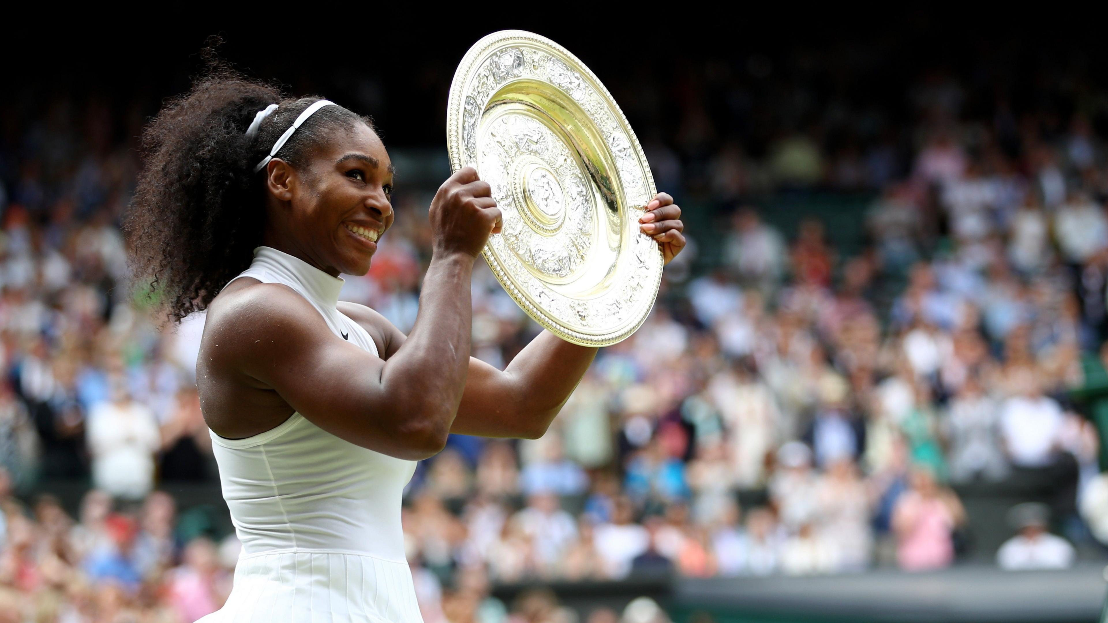 Serena Williams holds the Wimbledon women's singles trophy