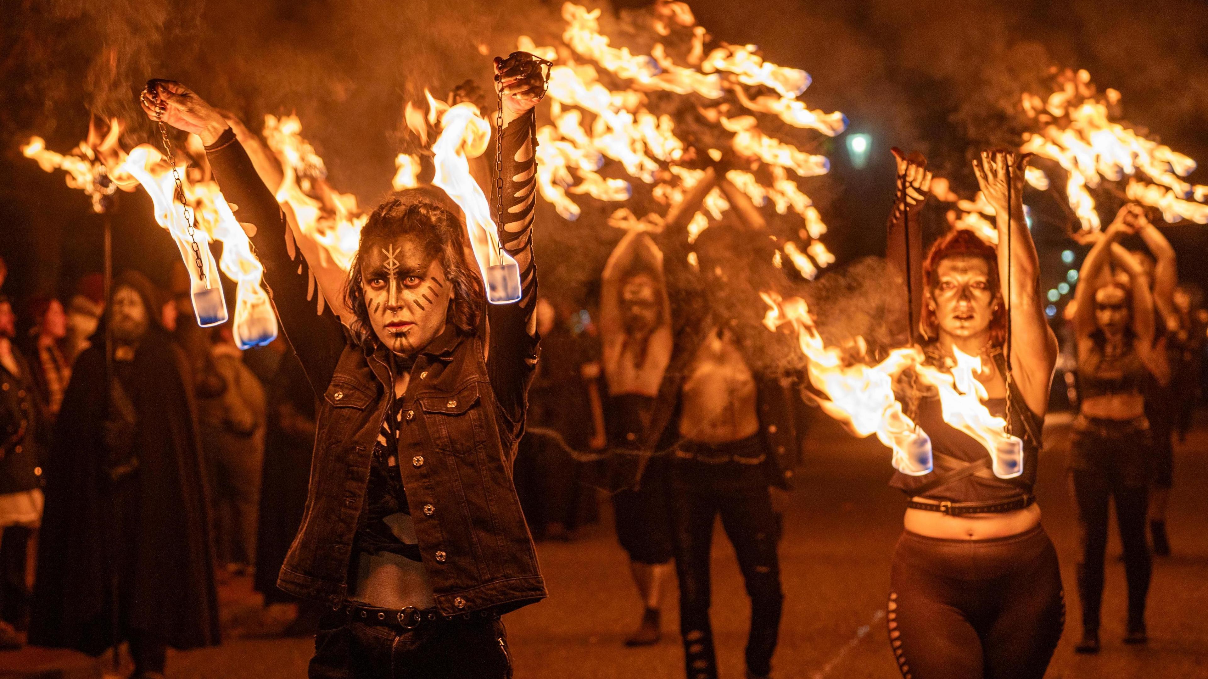 Performers marching with fire 