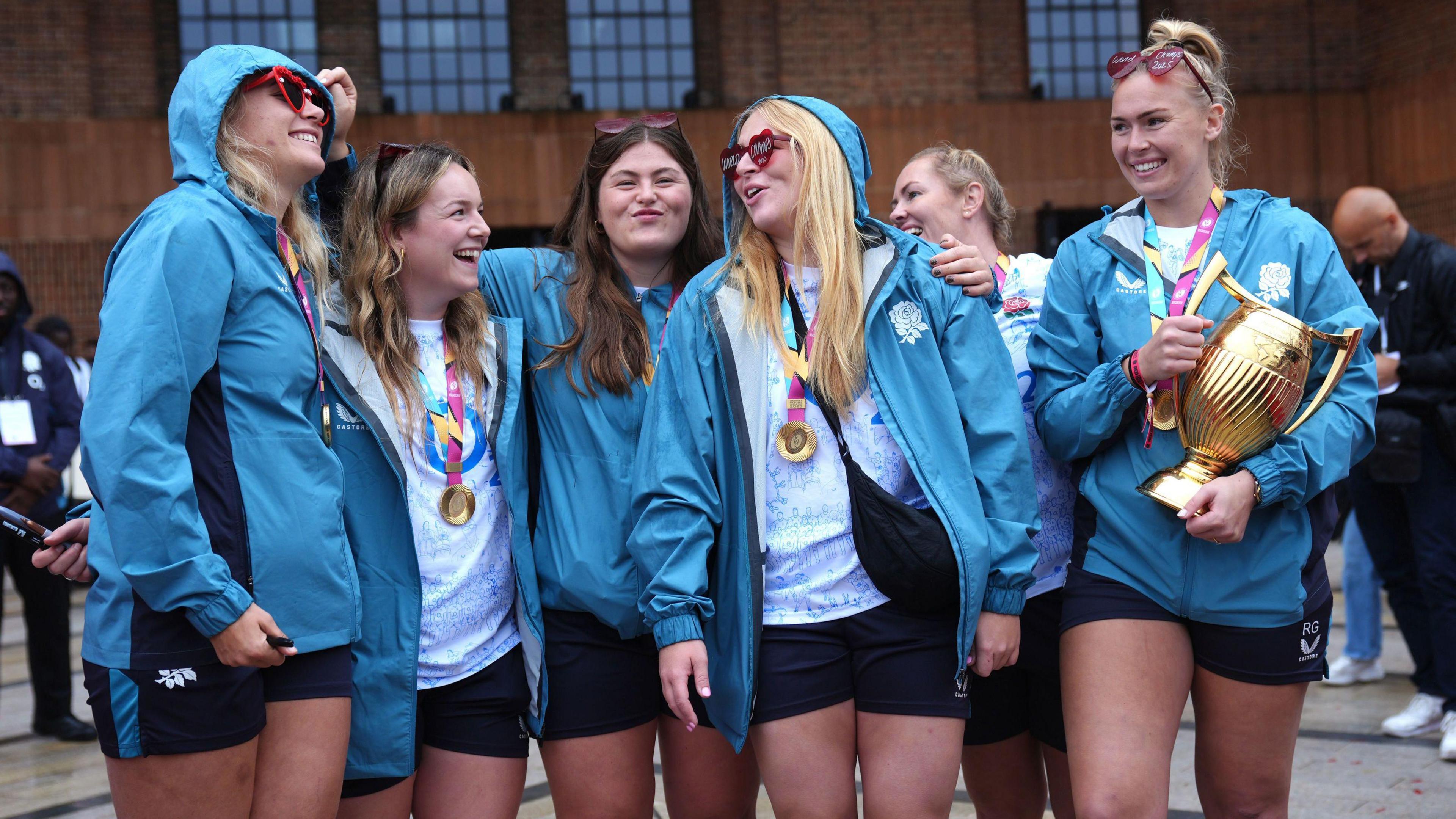 England's Rosie Galligan (right) with the trophy and team-mates during a Champions Party at Battersea Power Station, London. England won the Women's World Cup with a 33-13 victory over Canada at Allianz Stadium. Picture date: Sunday September 28, 2025. 