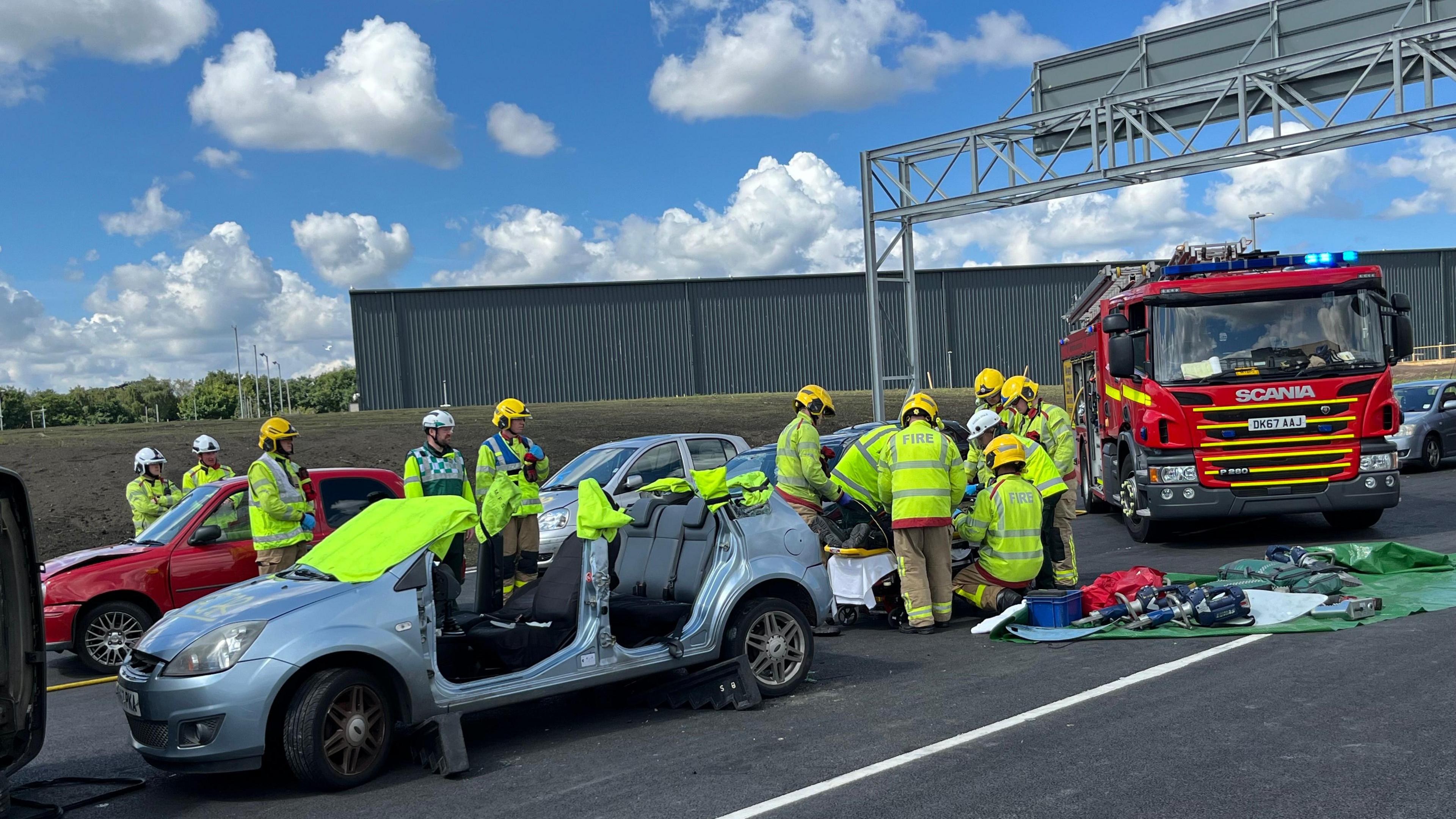 Firefighters training at the scene of a crash