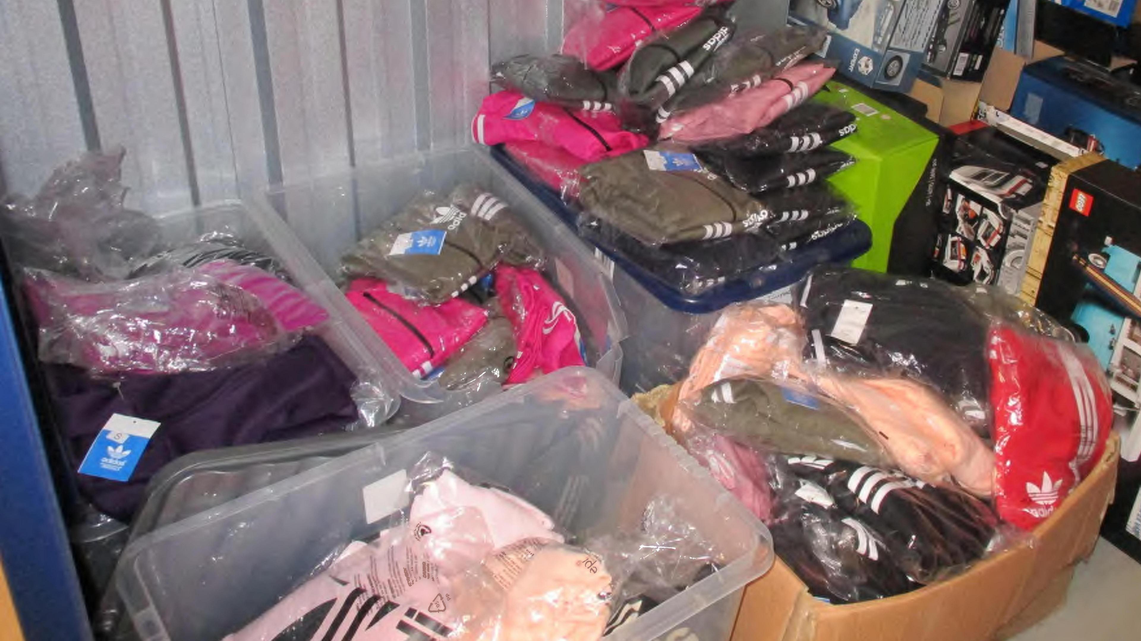 Boxes filled with fake Adidas clothing in a storage unit
