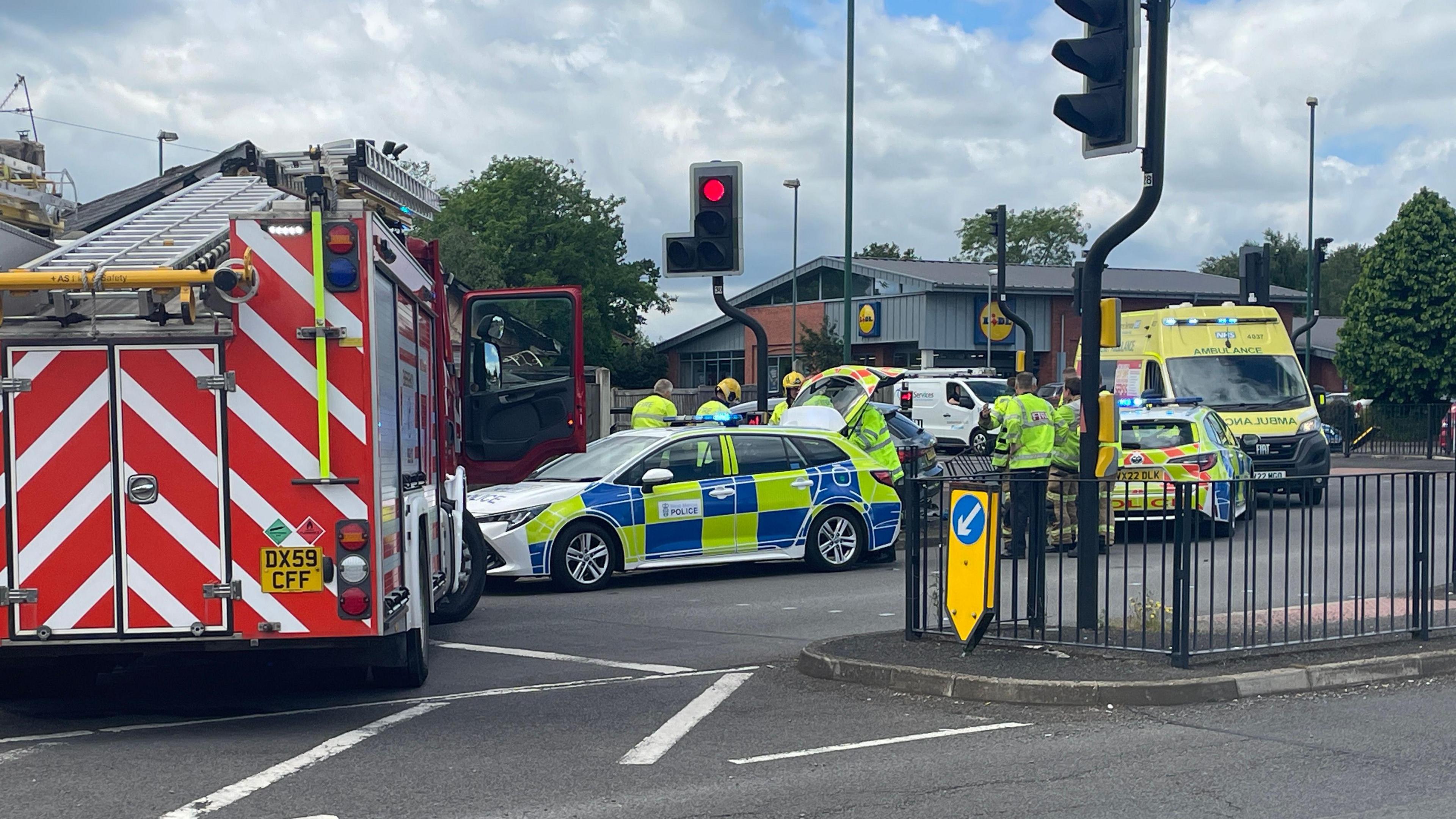 Fire engine, police and ambulance at the scene