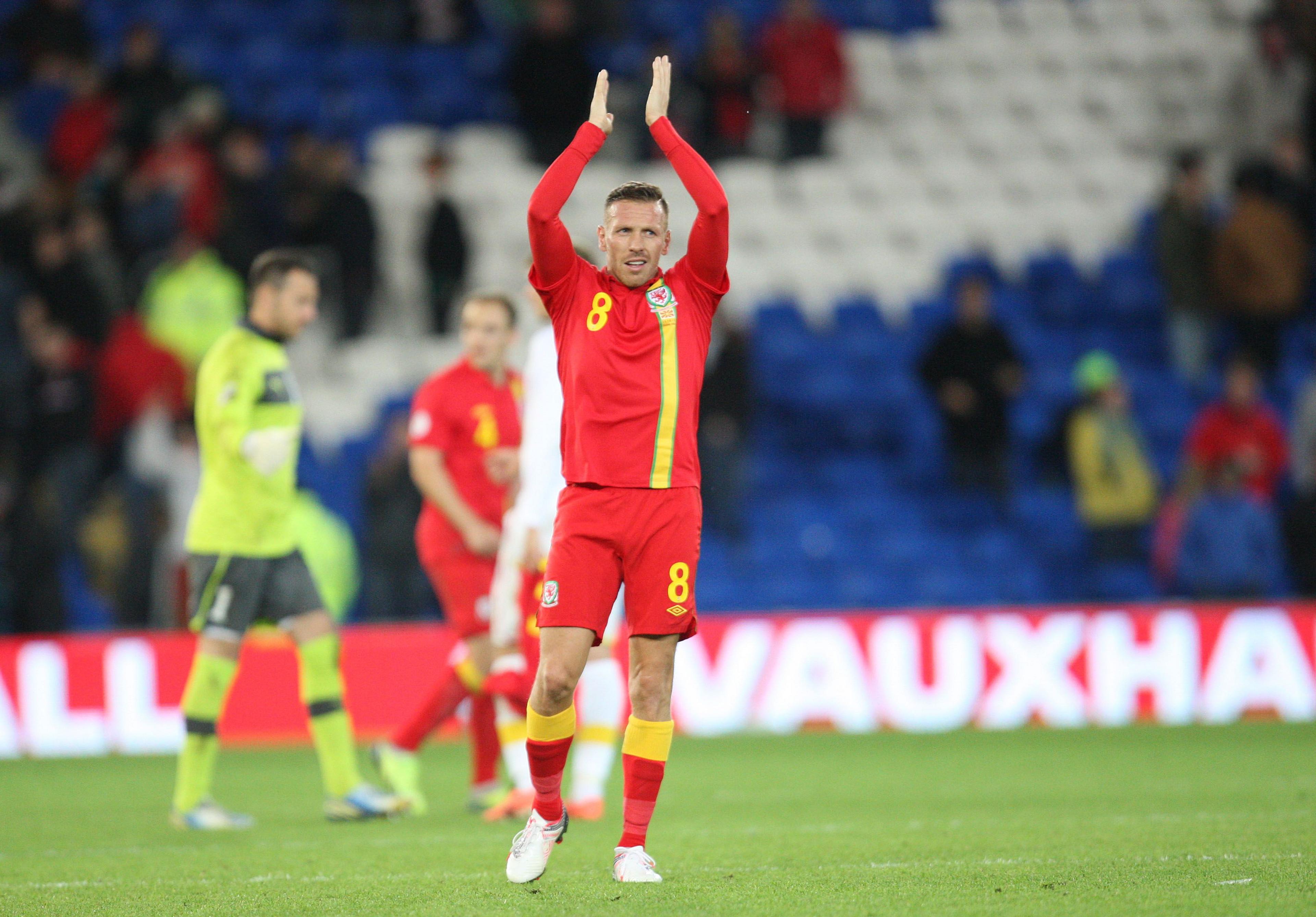 Craig Bellamy applauding after playing for Wales