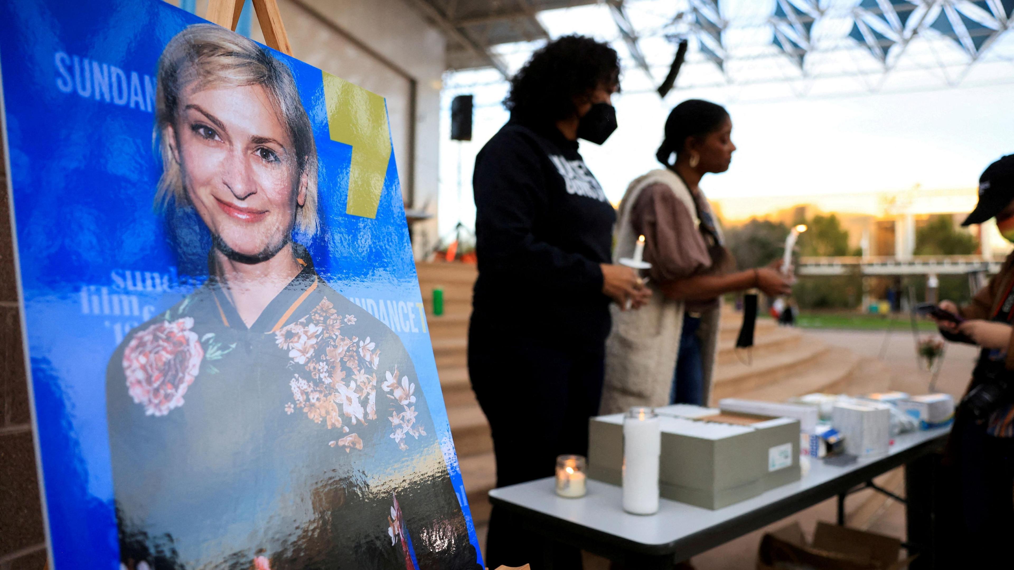 An image of cinematographer Halyna Hutchins displayed at a vigil after her death 