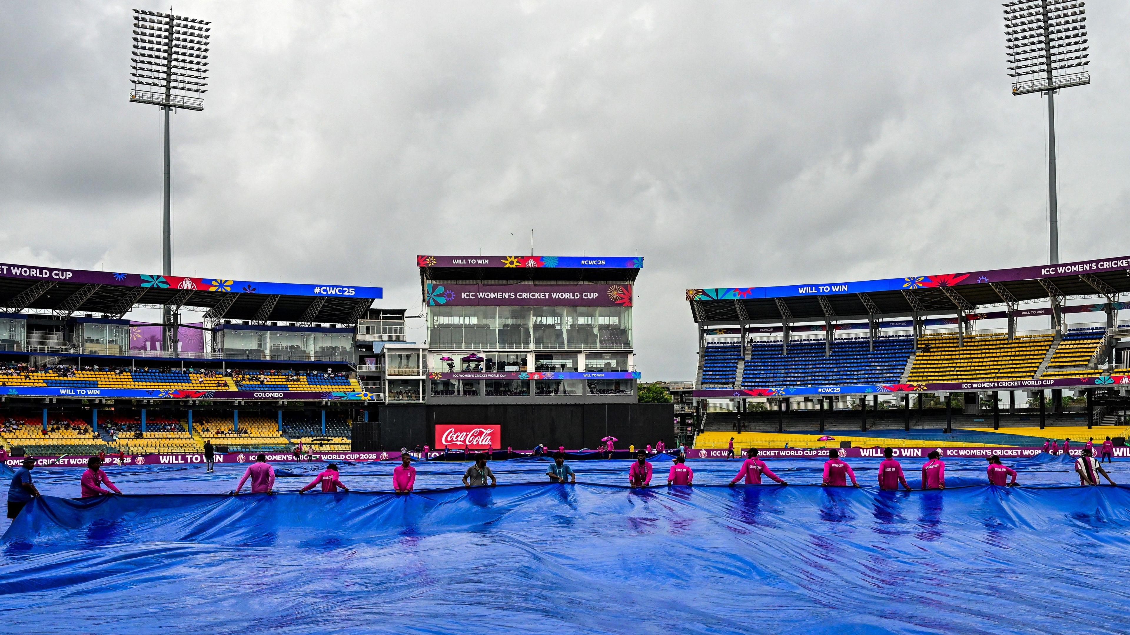 Groundstaff put the covers on in Colombo ahead of Australia v Sri Lanka at Women's Cricket World Cup