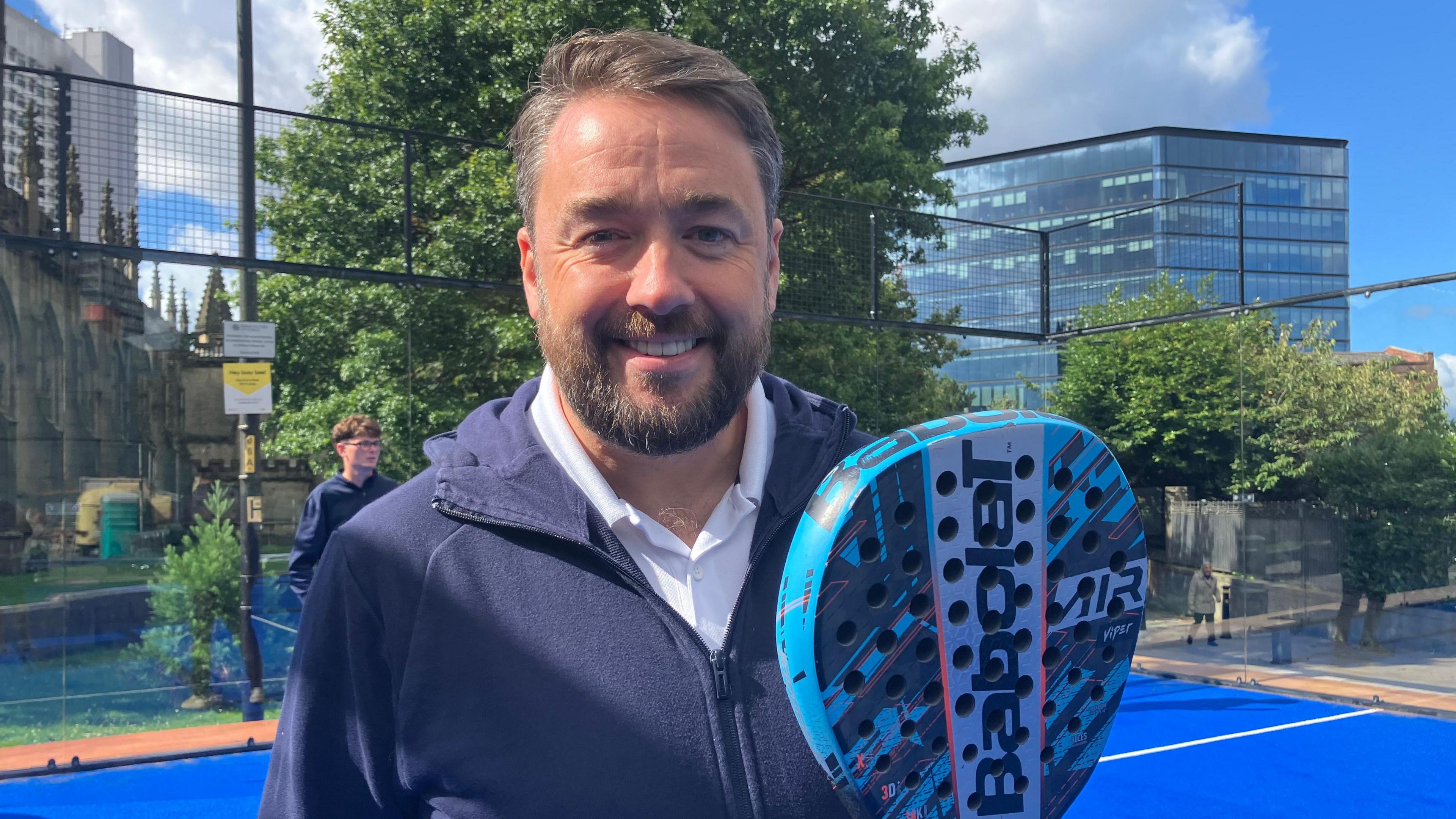 Jason Manford, holding a Padel tennis racket