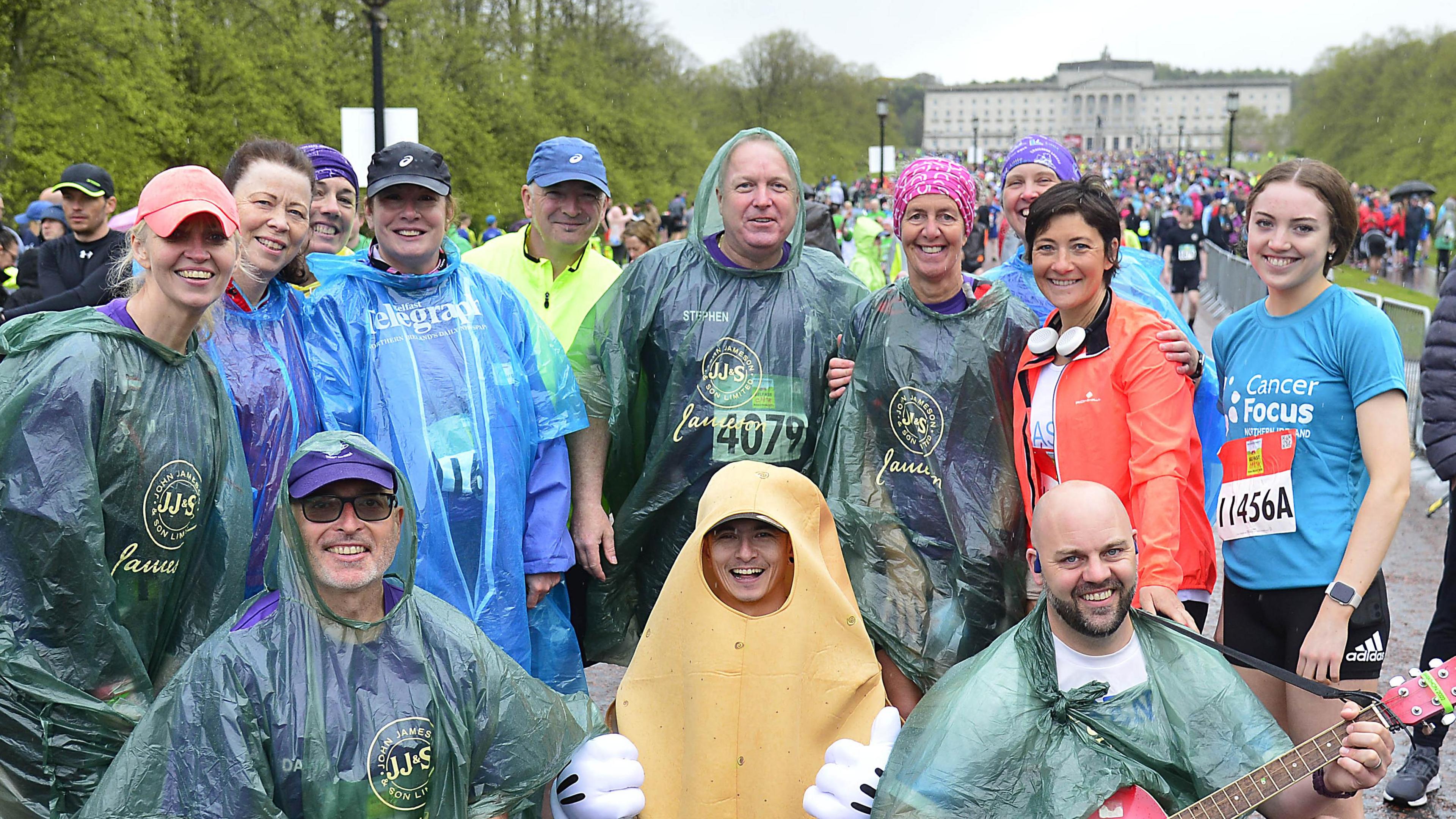 A group of runners pose before starting the race