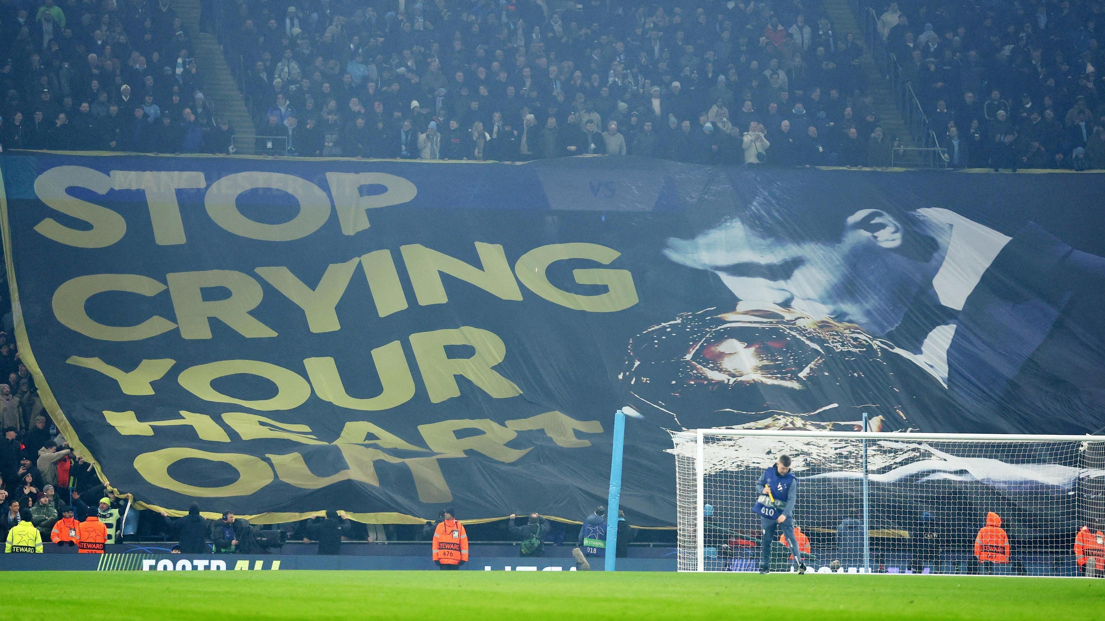 Manchester City fans display a Rodri banner inside the stadium before the match with Real Madrid