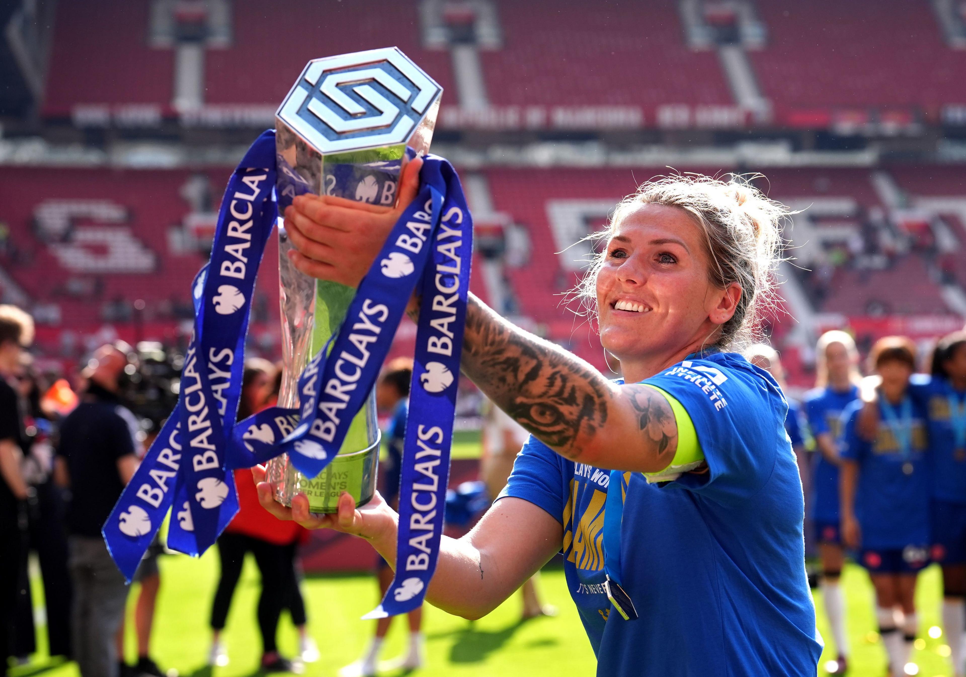 Chelsea's Millie Bright celebrates with the trophy after winning the Barclays Women's Super League match at Old Trafford, Manchester, 18 May 2024