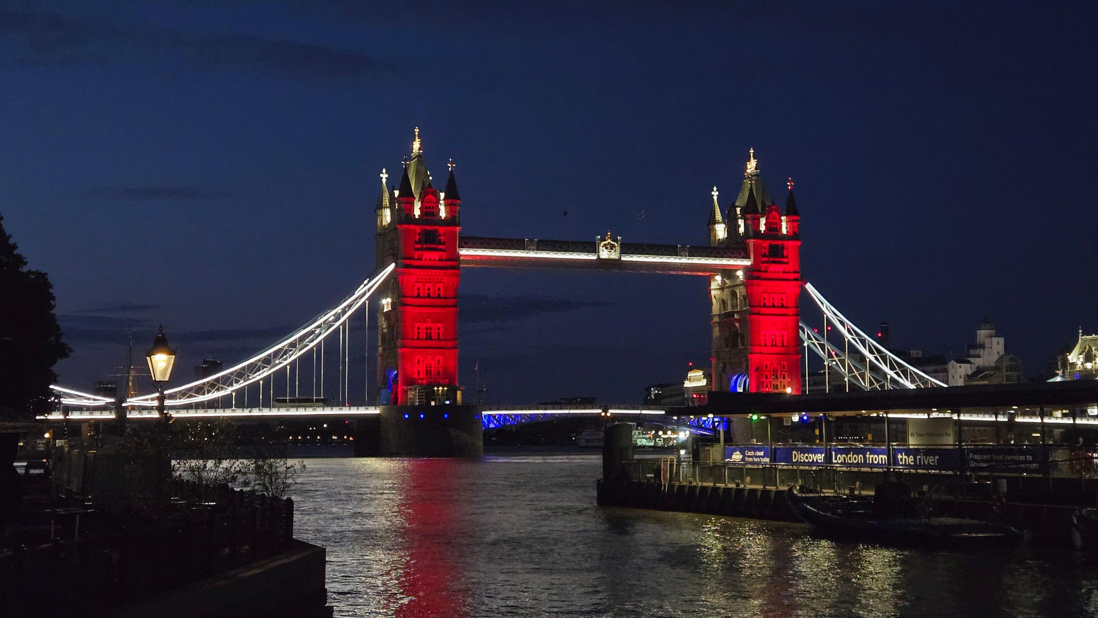 Tower Bridge in London lit up red, white and blue