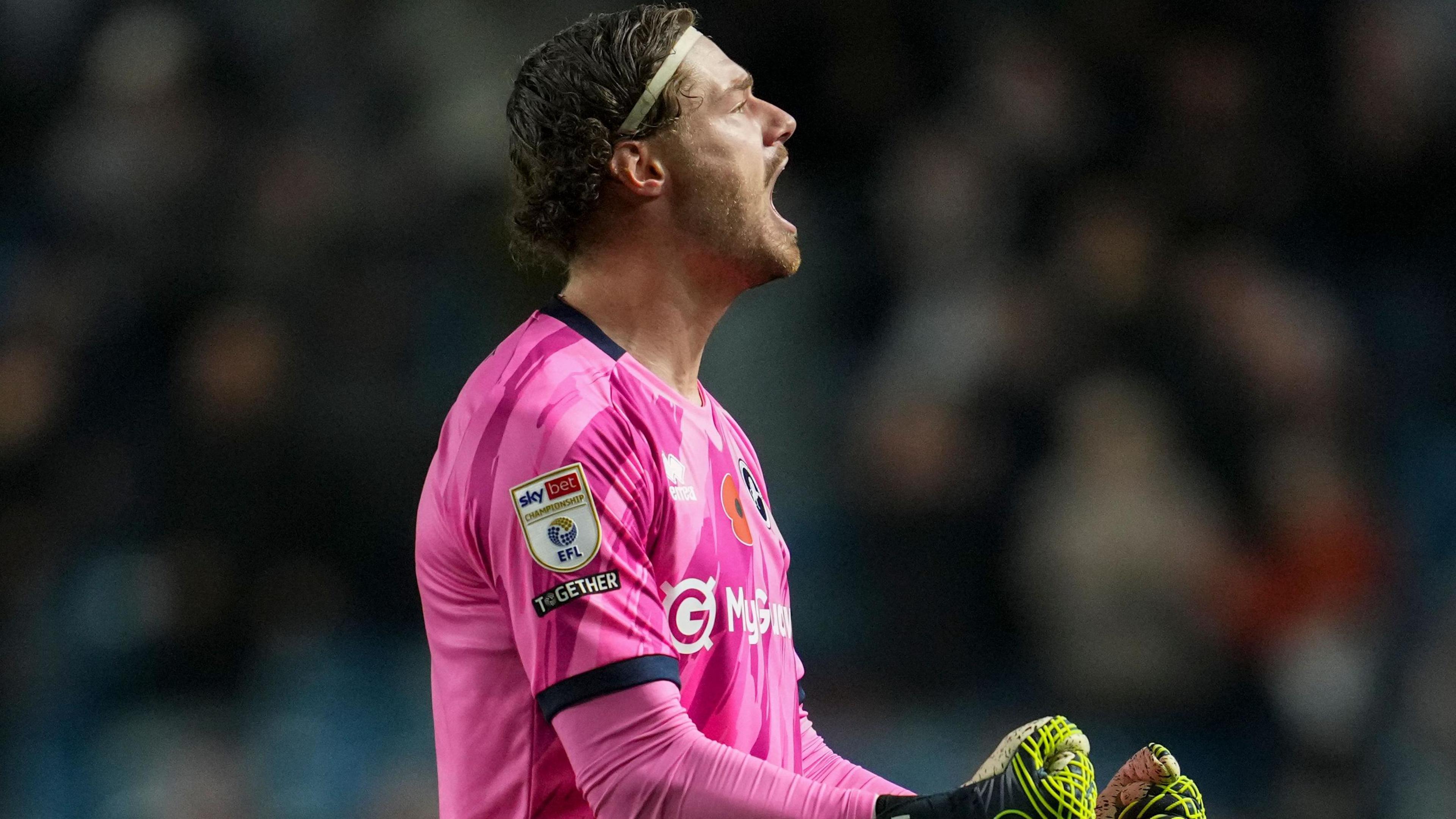 Lukas Jensen celebrates keeping a clean sheet for Millwall 