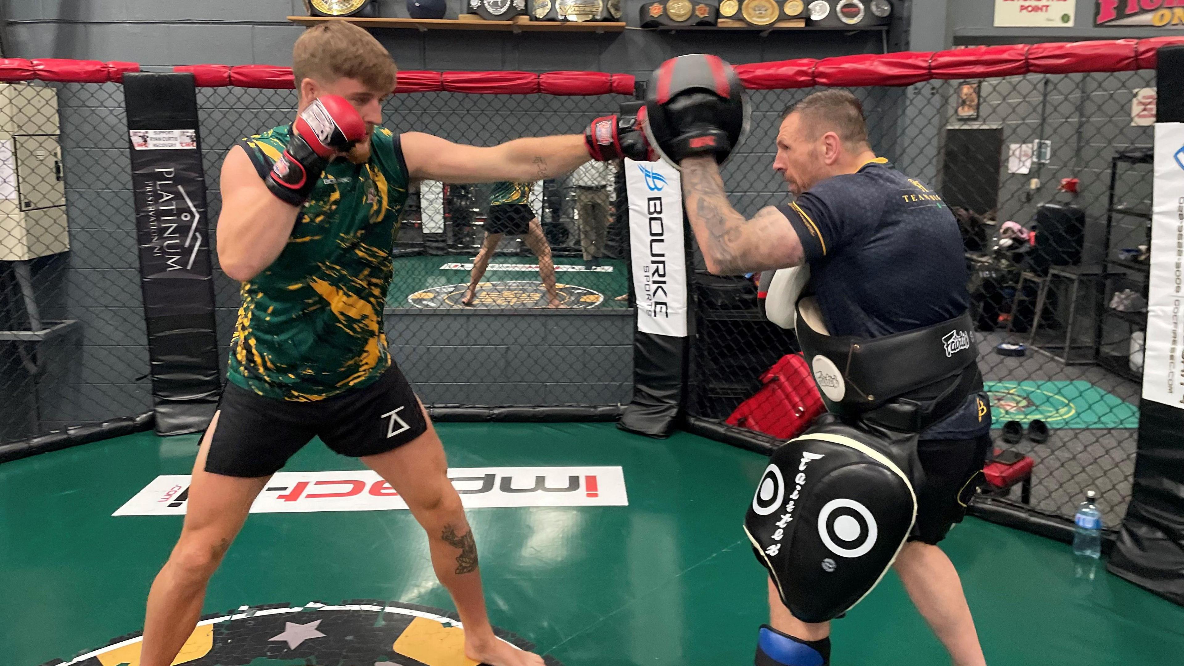 Paddy McCorry fights an opponent in the ring