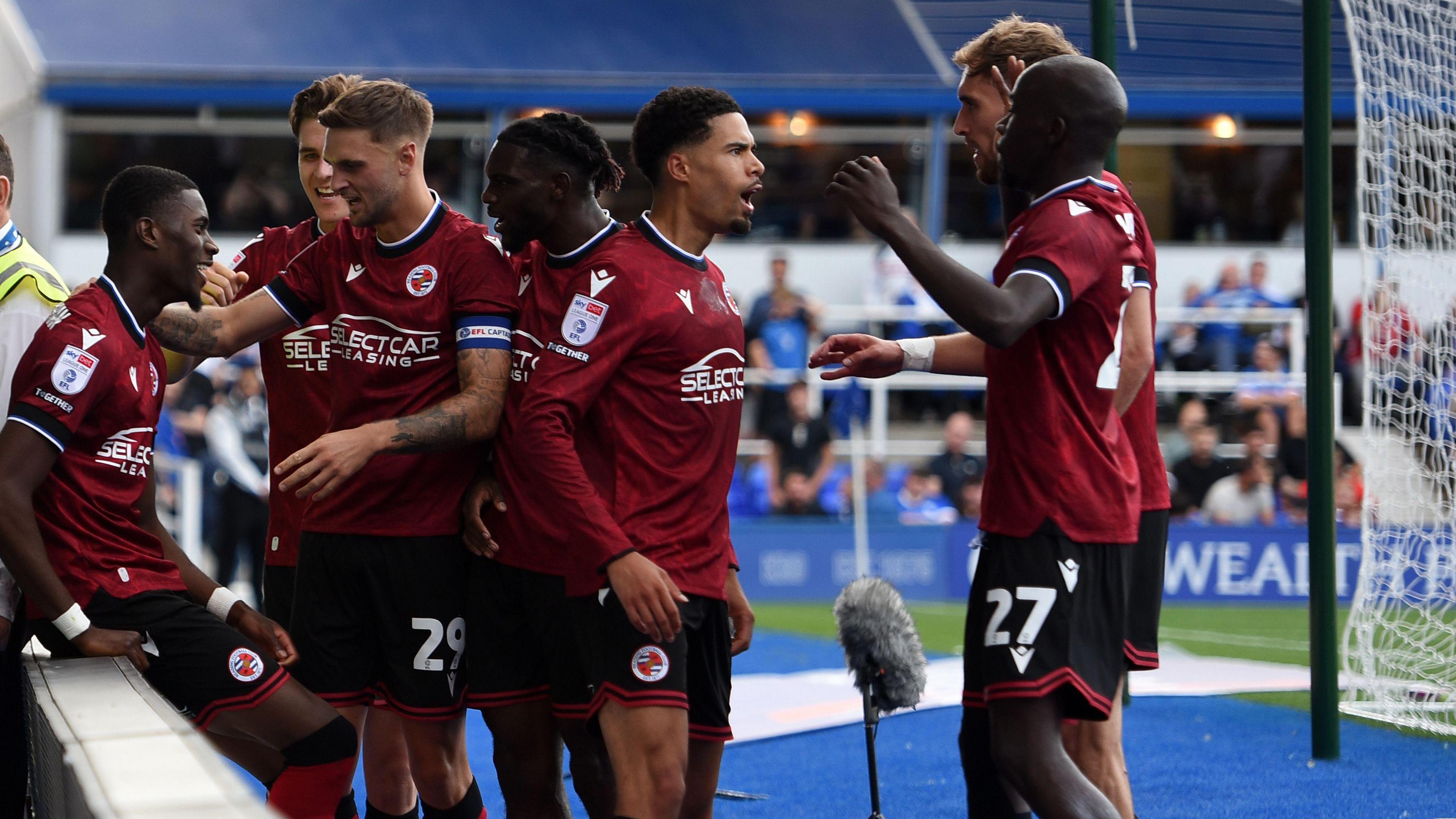 Kelvin Ehibhatiomhan of Reading FC celebrates with his teammates after putting his side 1-0 up against Birmingham City 