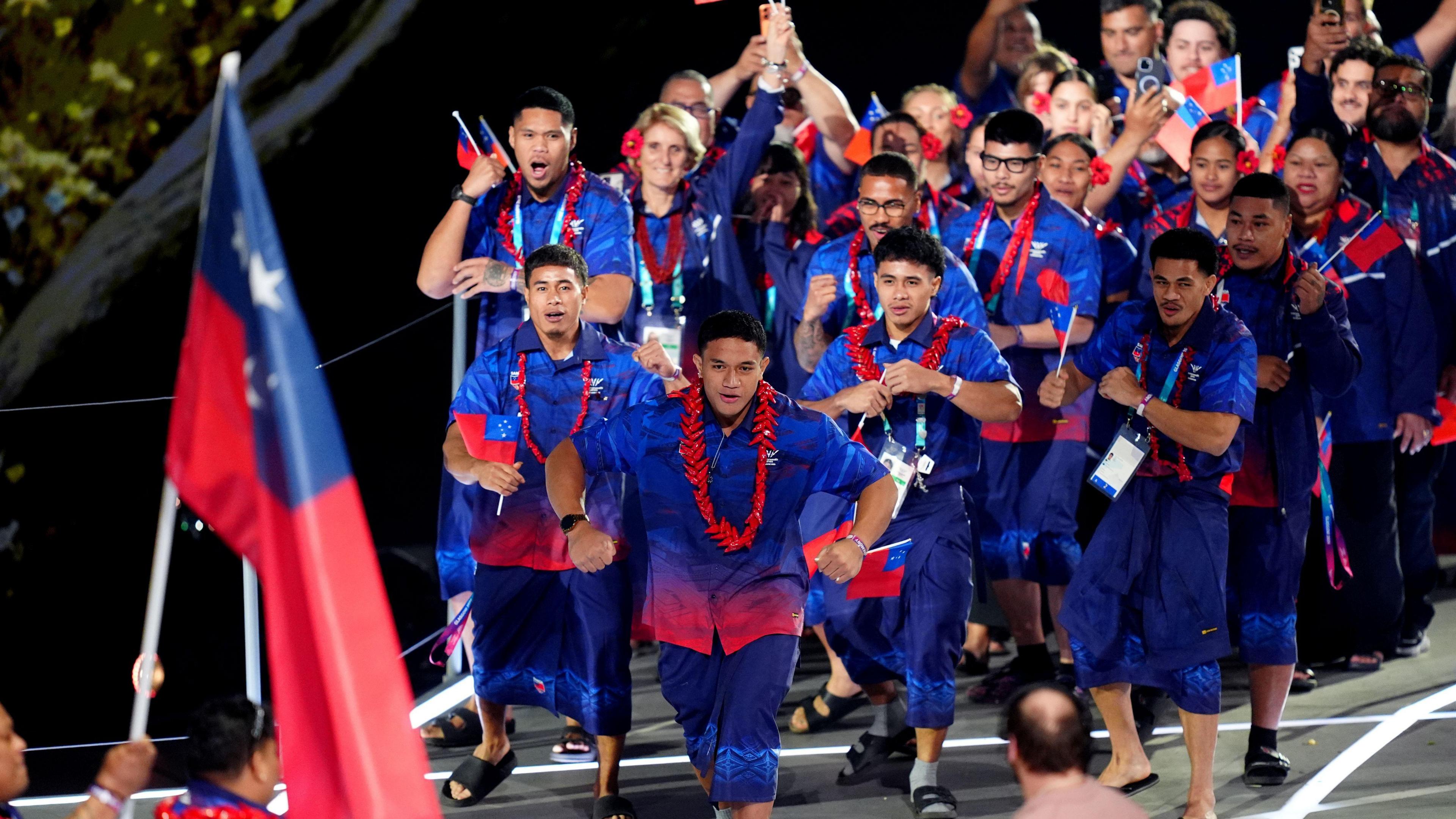 Samoa team in blue and red shirts and shorts