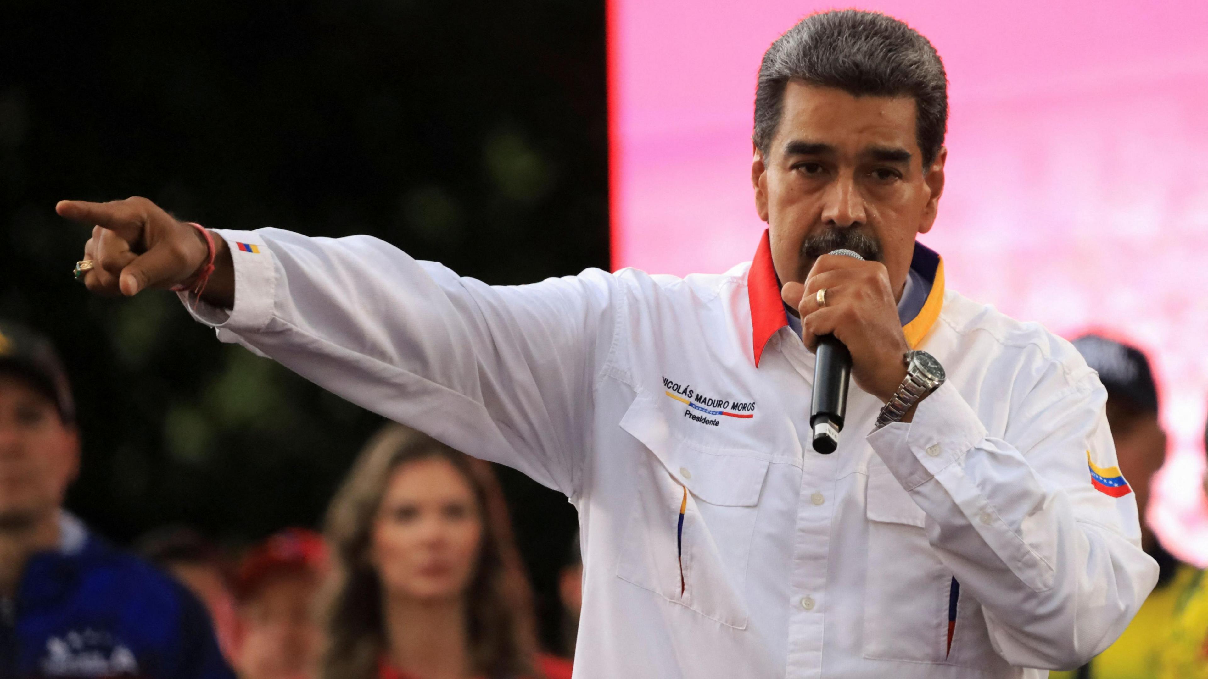 President Nicolas Maduro speaks during a march in Caracas