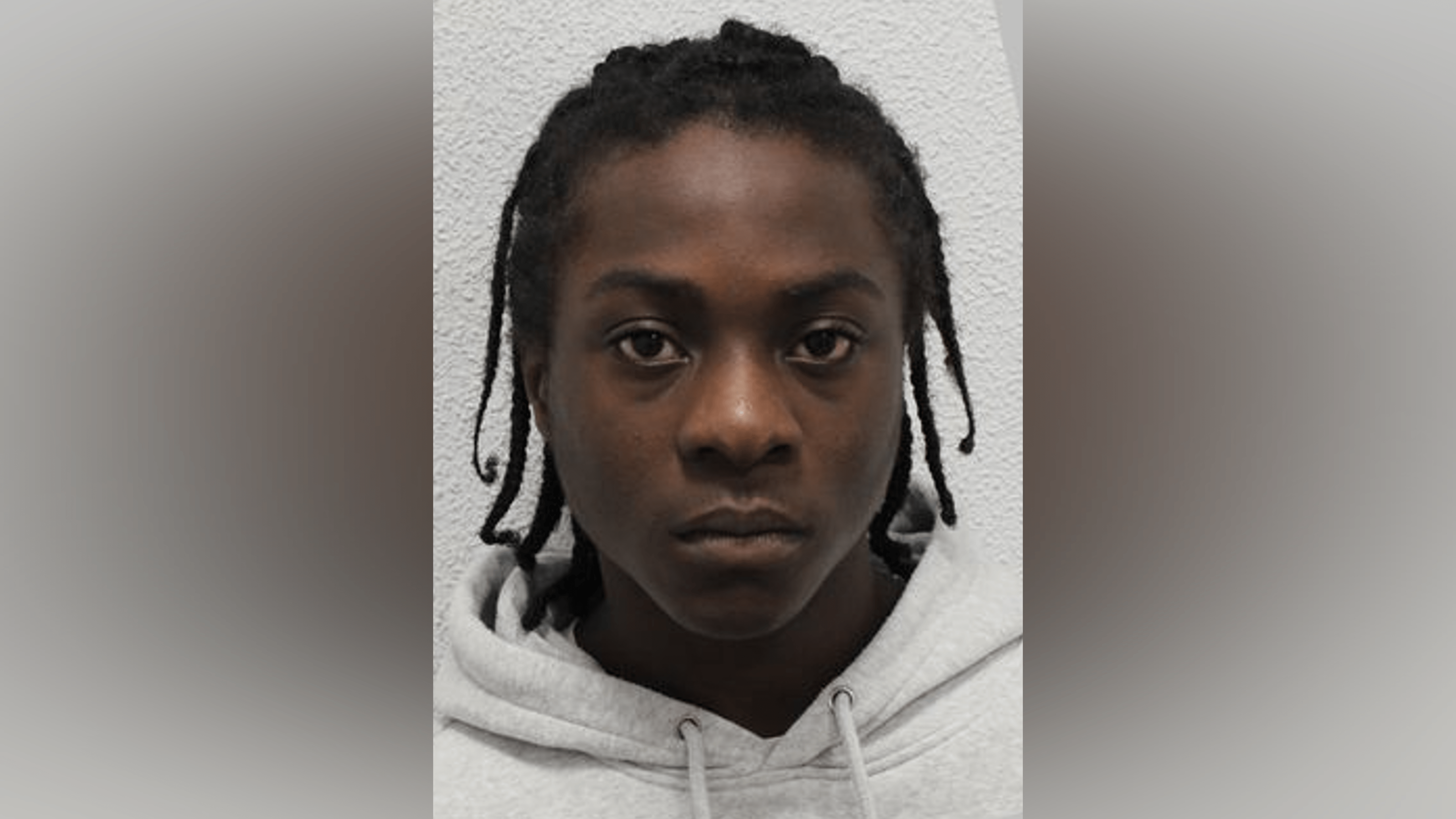 Romario Gordon in a light grey hoodie.