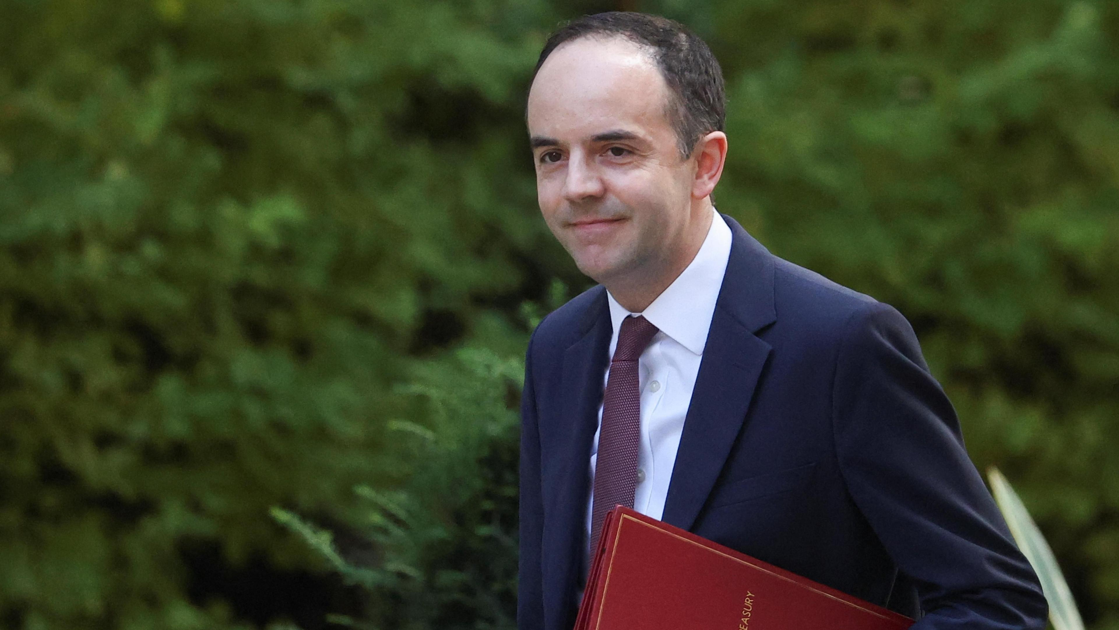 Britain's Chief Secretary to the Treasury James Murray arrives for a cabinet meeting at Downing Street in London, Britain, September 2, 2025. He has a dark hair, a navy suit, white shirt, aubergine tie and carries the red secretary to the Treasury book.