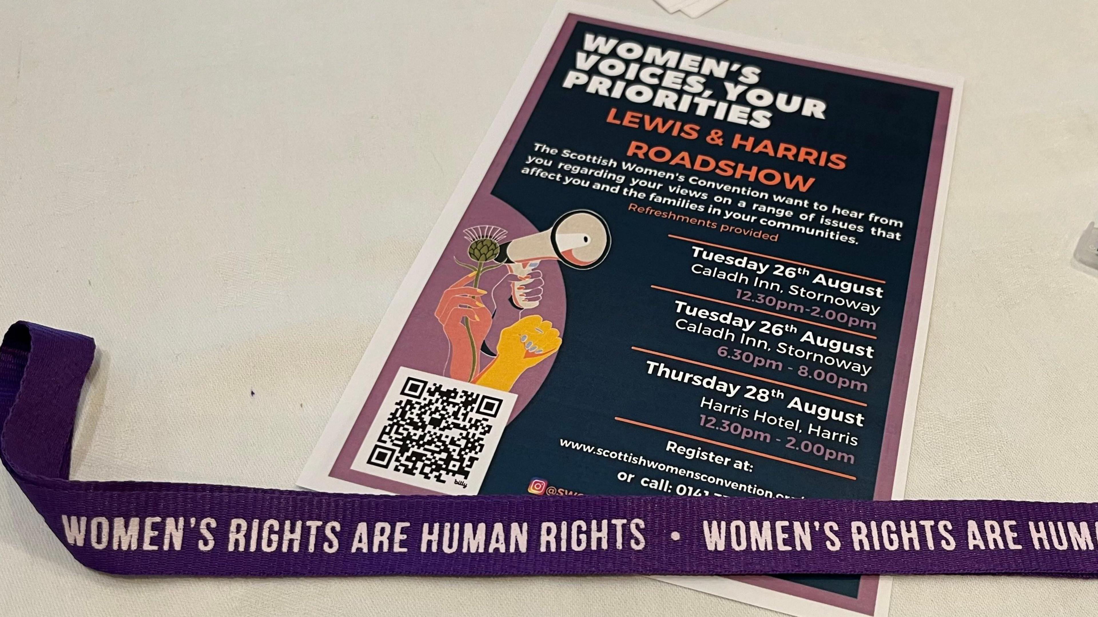 Dealbh a' sealltainn bileag fiosrachaidh mu na seiseanan fiosrachaidh a thathar a' cumail ann an Leòdhas agus na Hearadh an t-seachdain-sa agus lainneard le 'Women's Rights Are Human Rights' sgrìobht' air. 