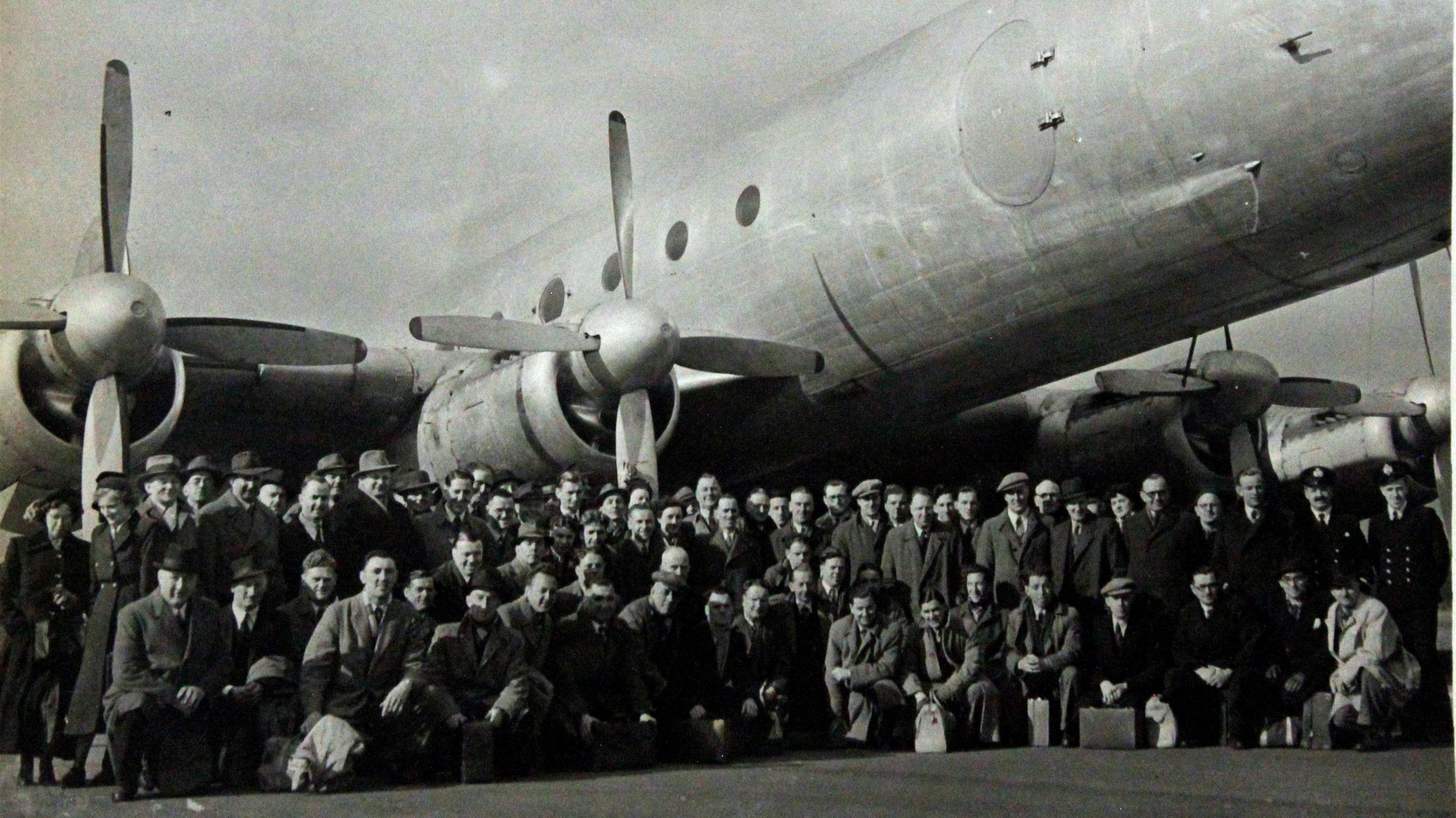 A group of people with cases photographed in front of the Avro Tudor aircraft before it set off for Ireland.