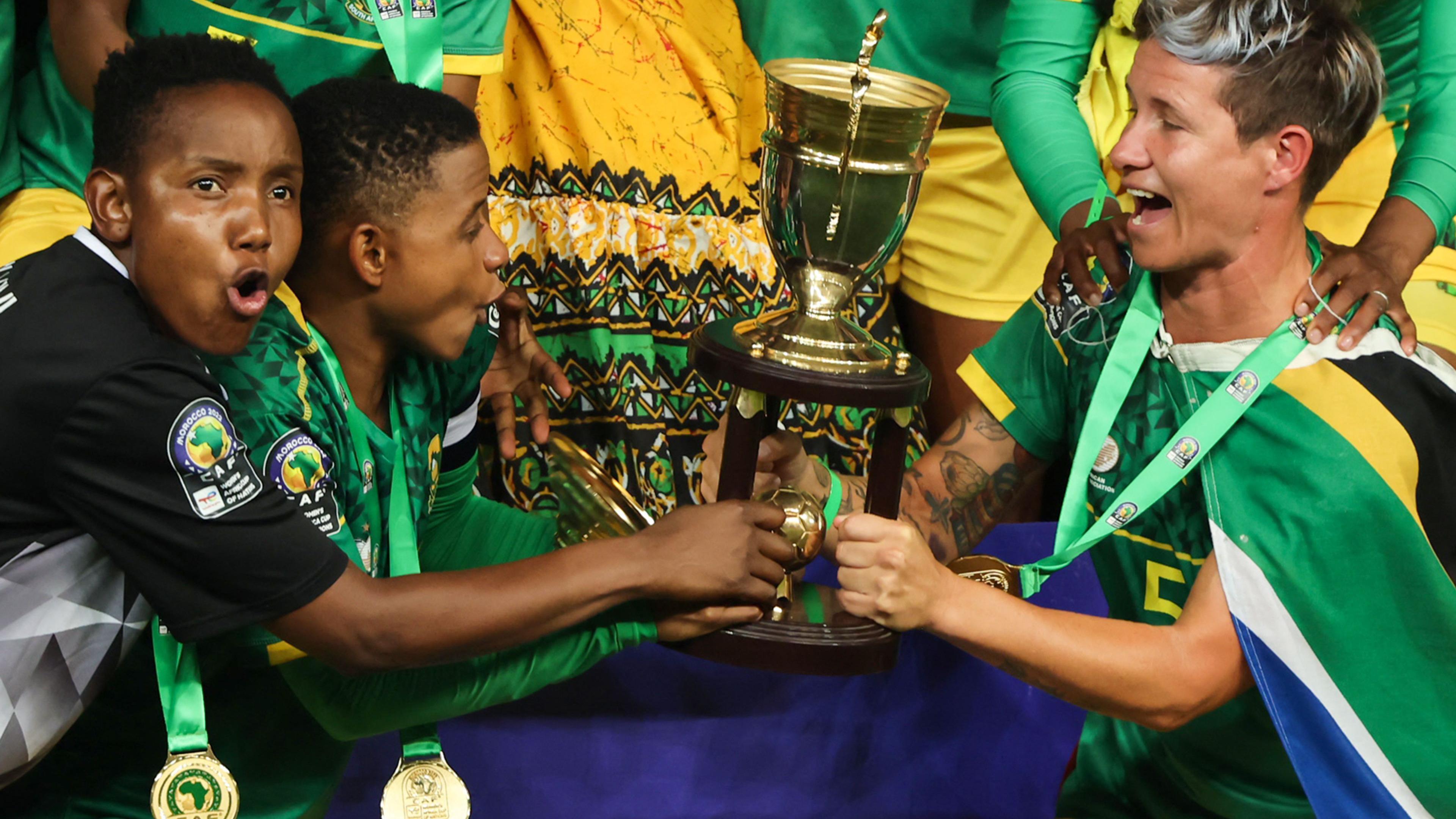 South African players hold up the Women's Africa Cup of Nations trophy