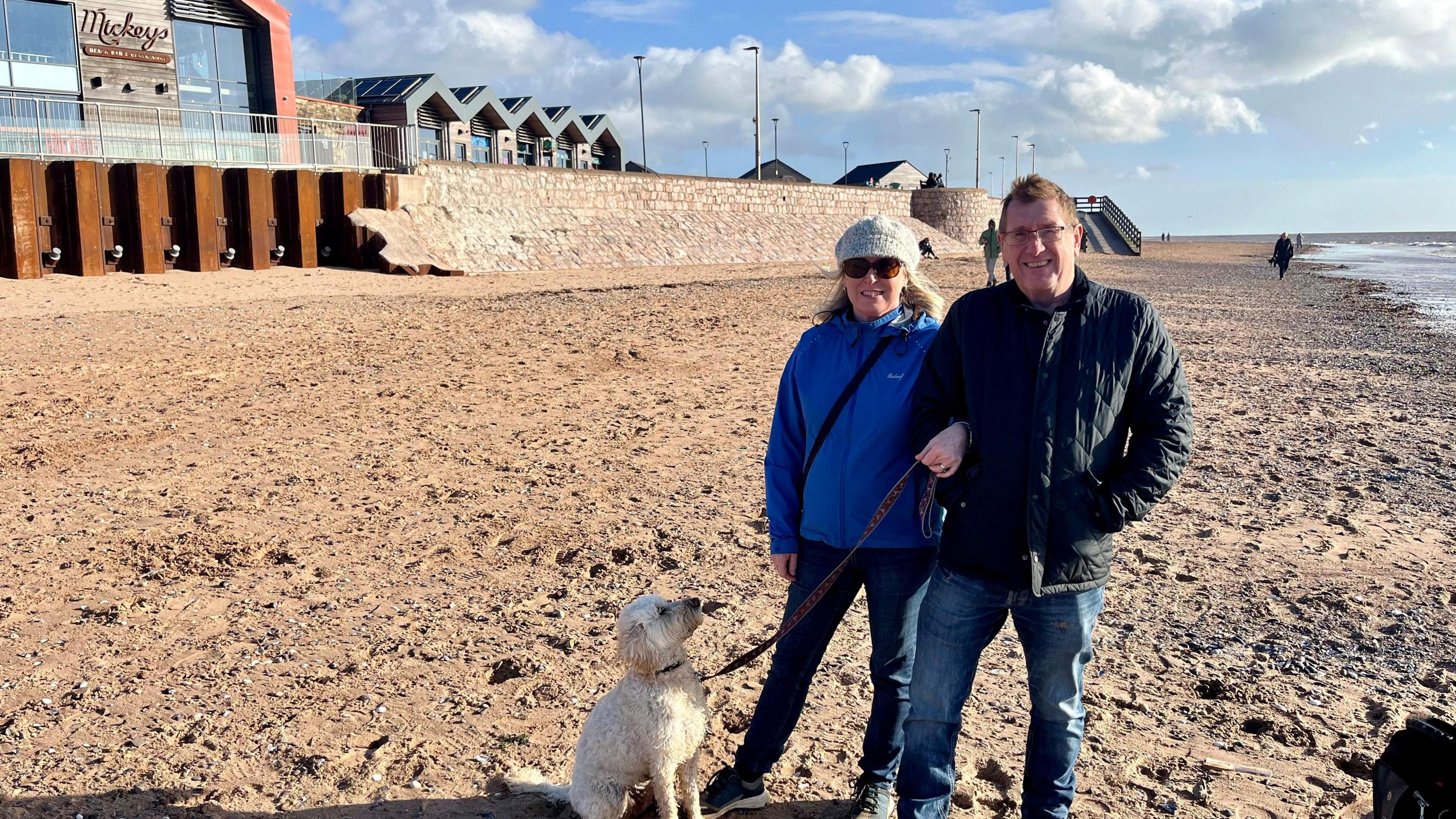 Sandra and Kevin Bowden on the beach in Exmouth with their dog