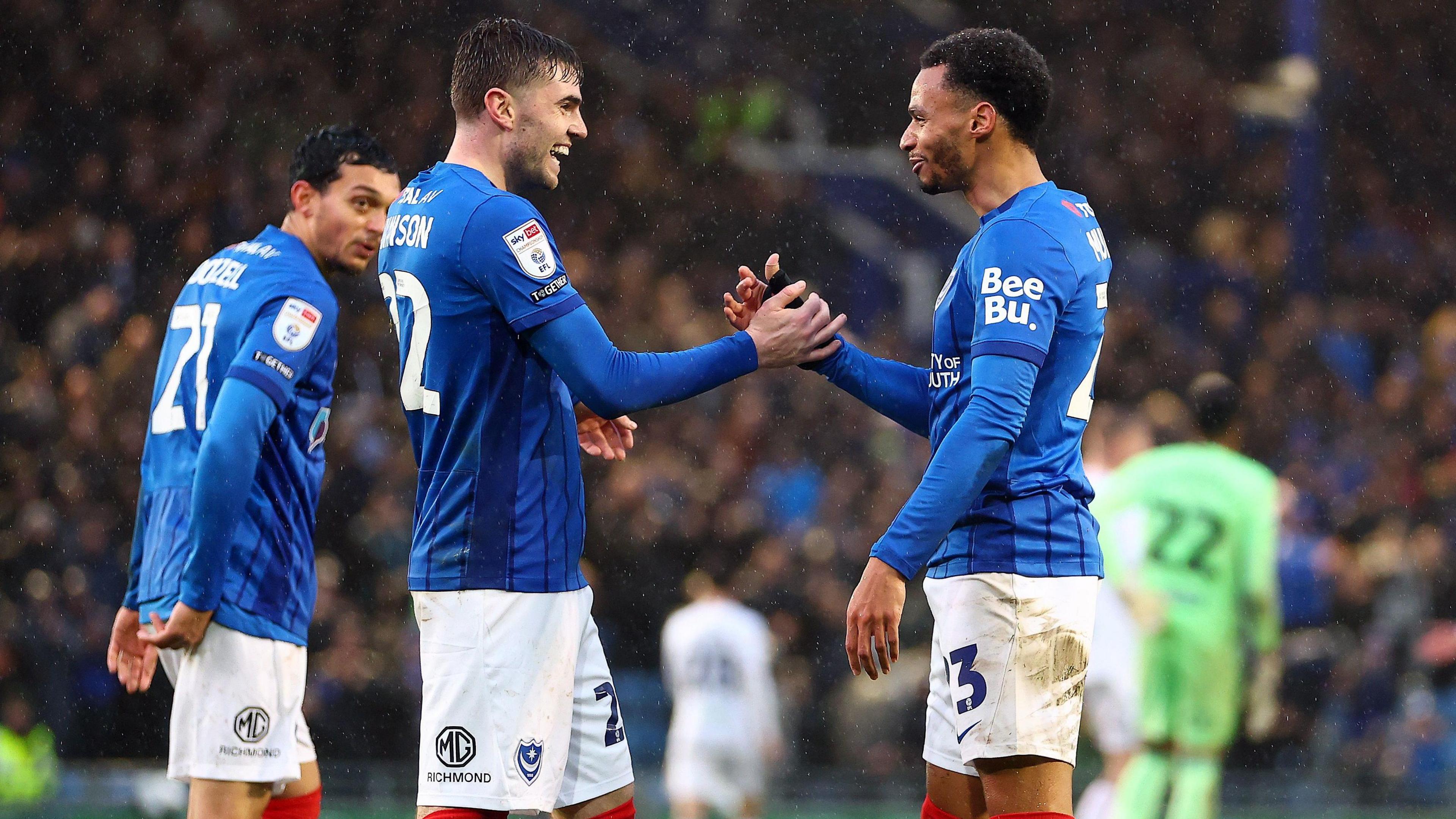 Zak Swanson and Josh Murphy celebrate Portsmouth's opening goal in the 4-0 win over Swansea City at Fratton Park in the Championship