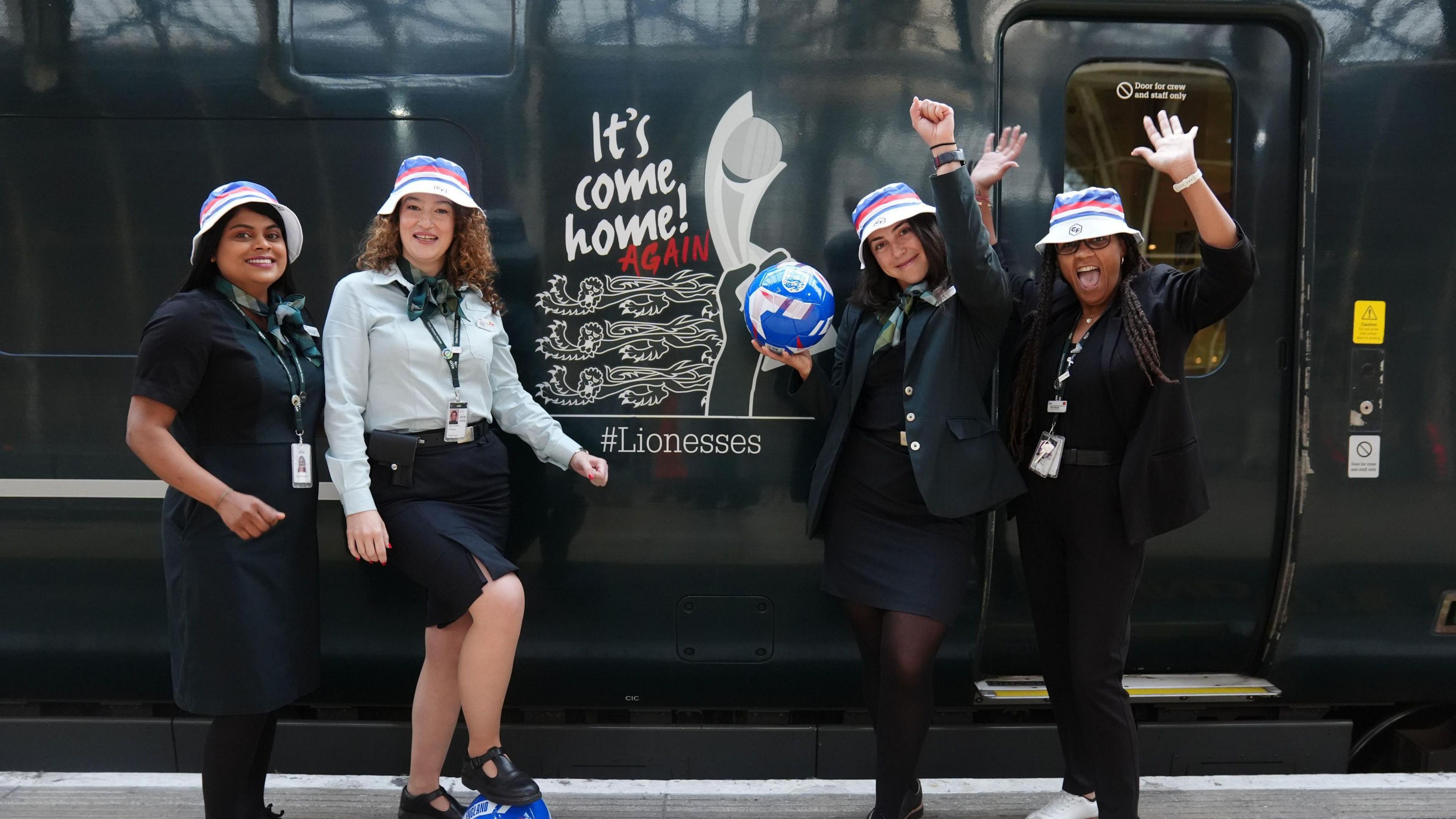 GWR staff members help decorate the 0730 service from London Paddington to Bristol after the Lionesses won the UEFA Women's Euro 2025 final 
