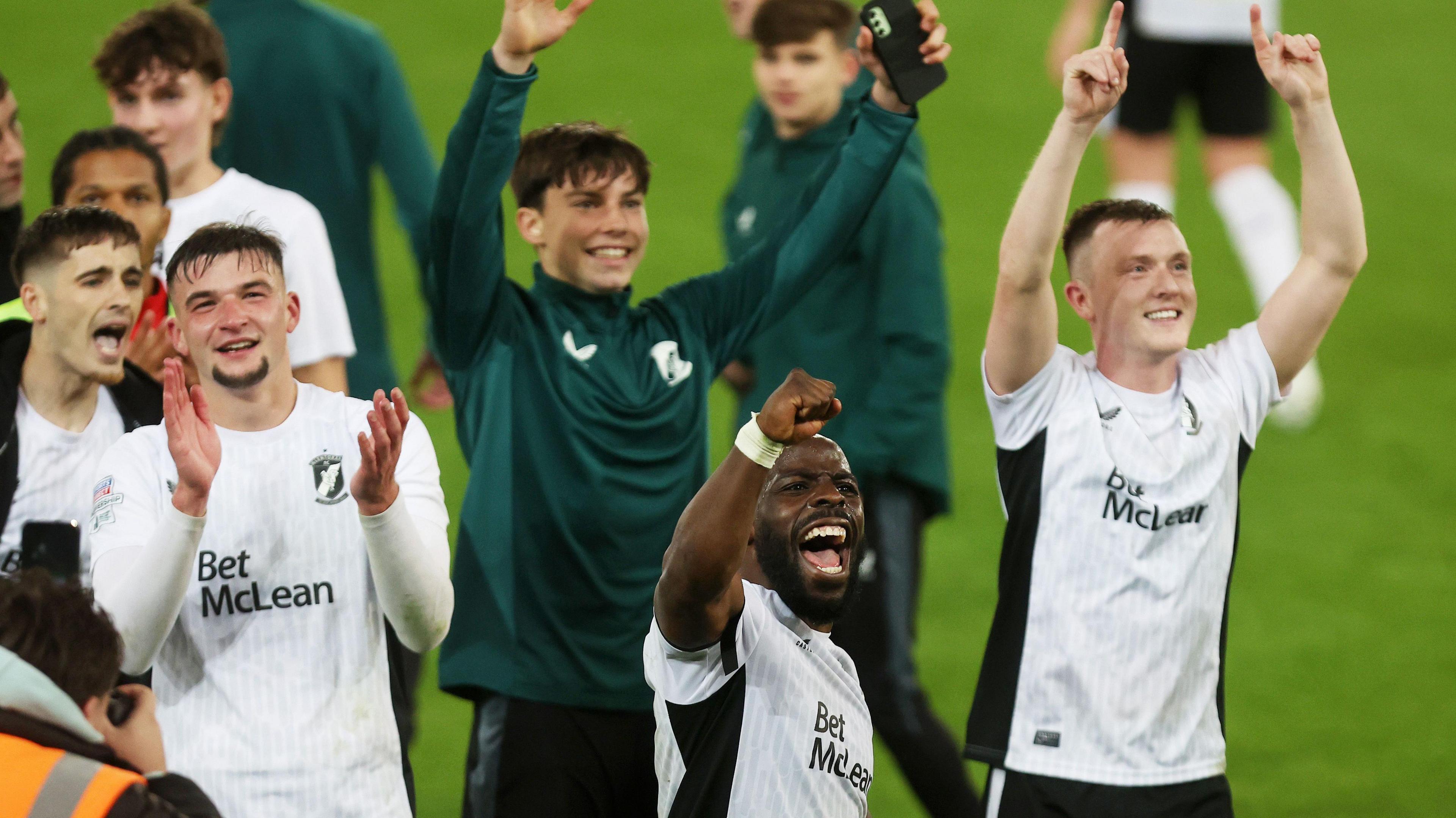 Glentoran players celebrate their 3-1 win over Linfield at Windsor Park on 4 October