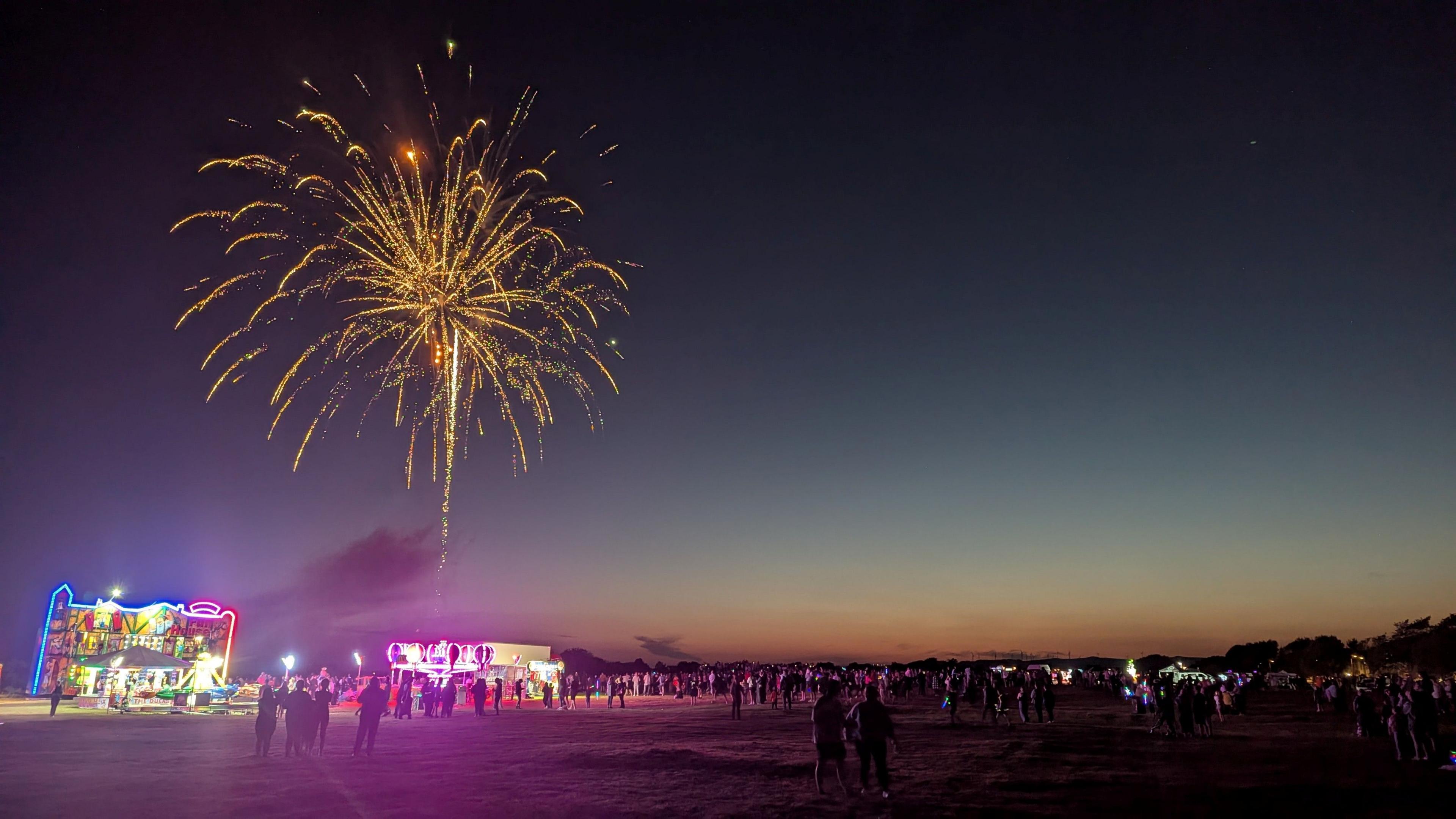 A firework display over a large area of ground
