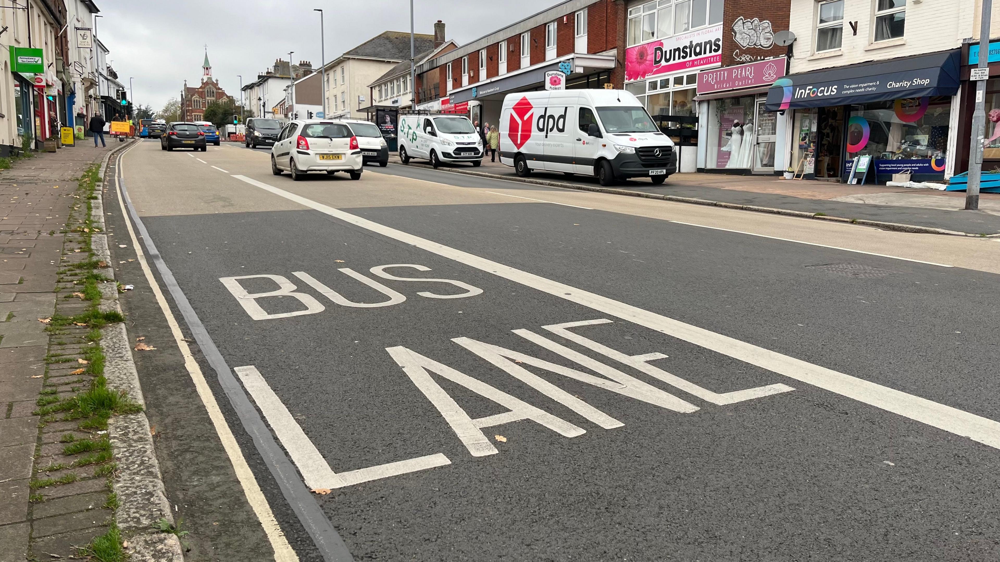 Fore Street in Heavitree with a bus lane marked on the left hand side 