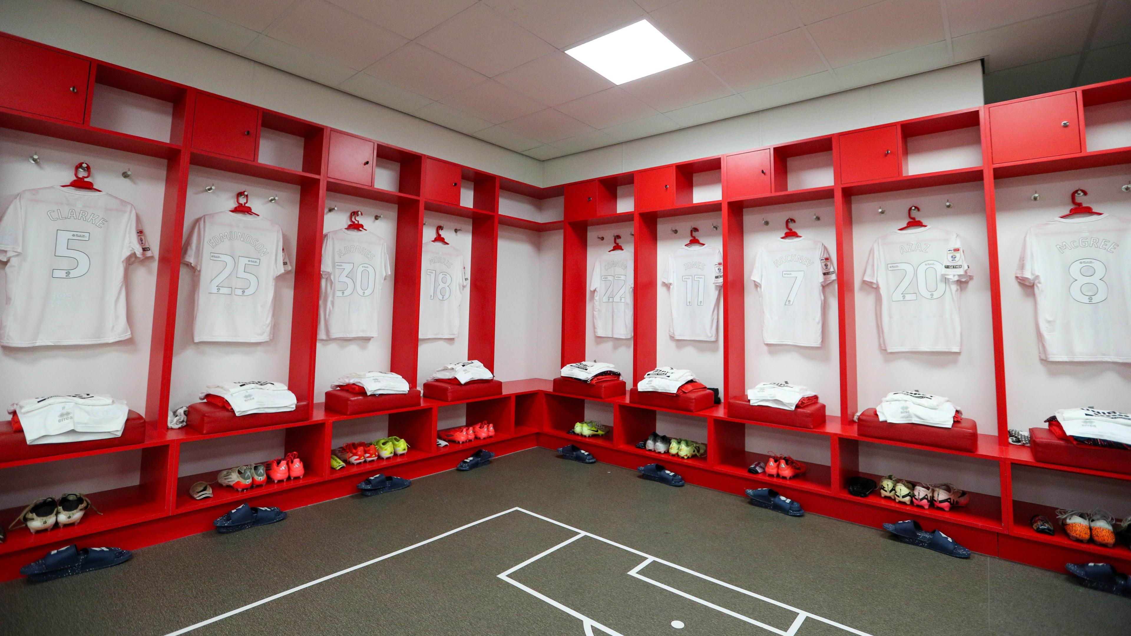 The Middlesbrough FC changing room displaying an all-white football kit.