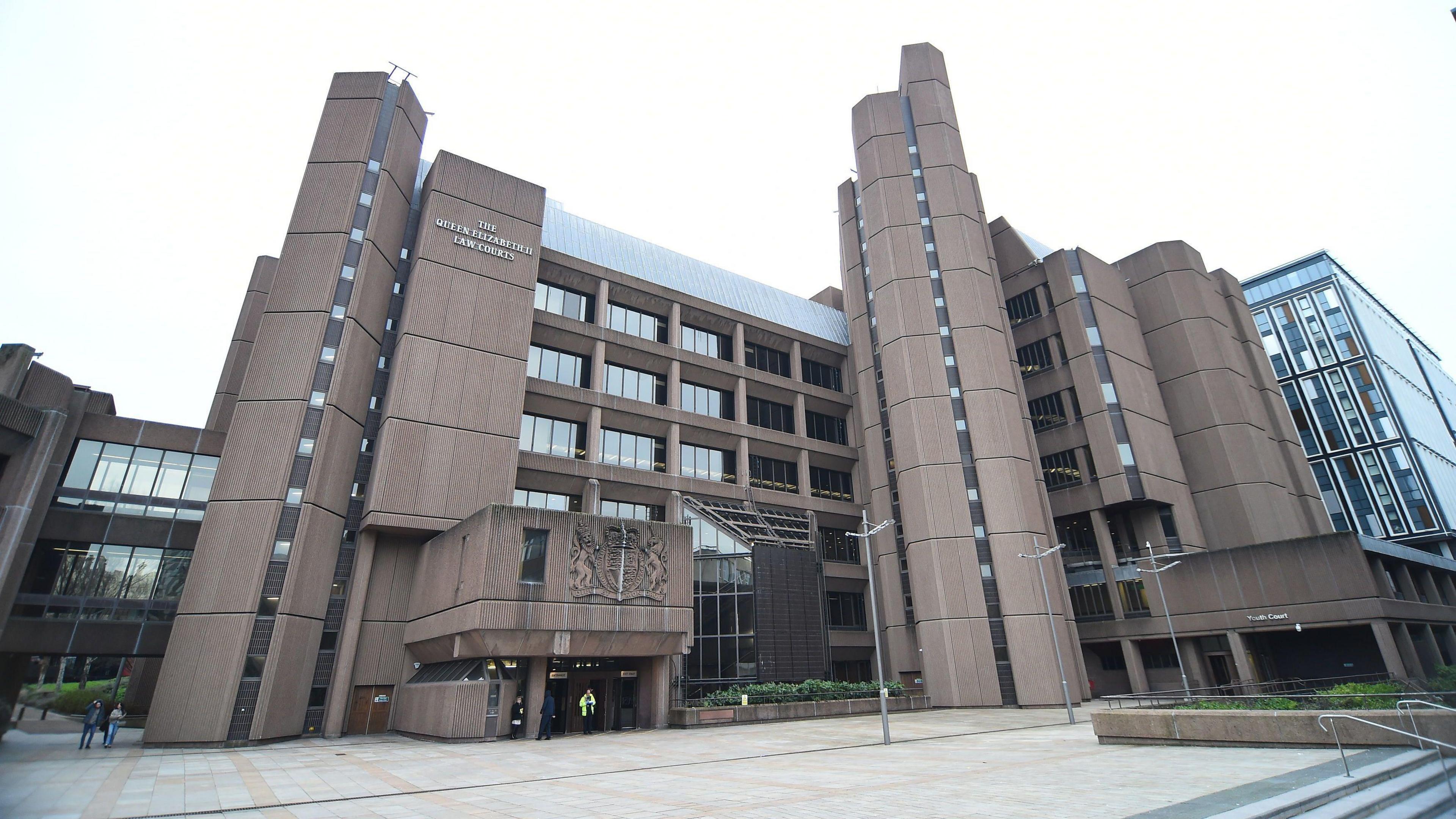 Liverpool Crown Court, which is a six storey building with a brown concrete exterior