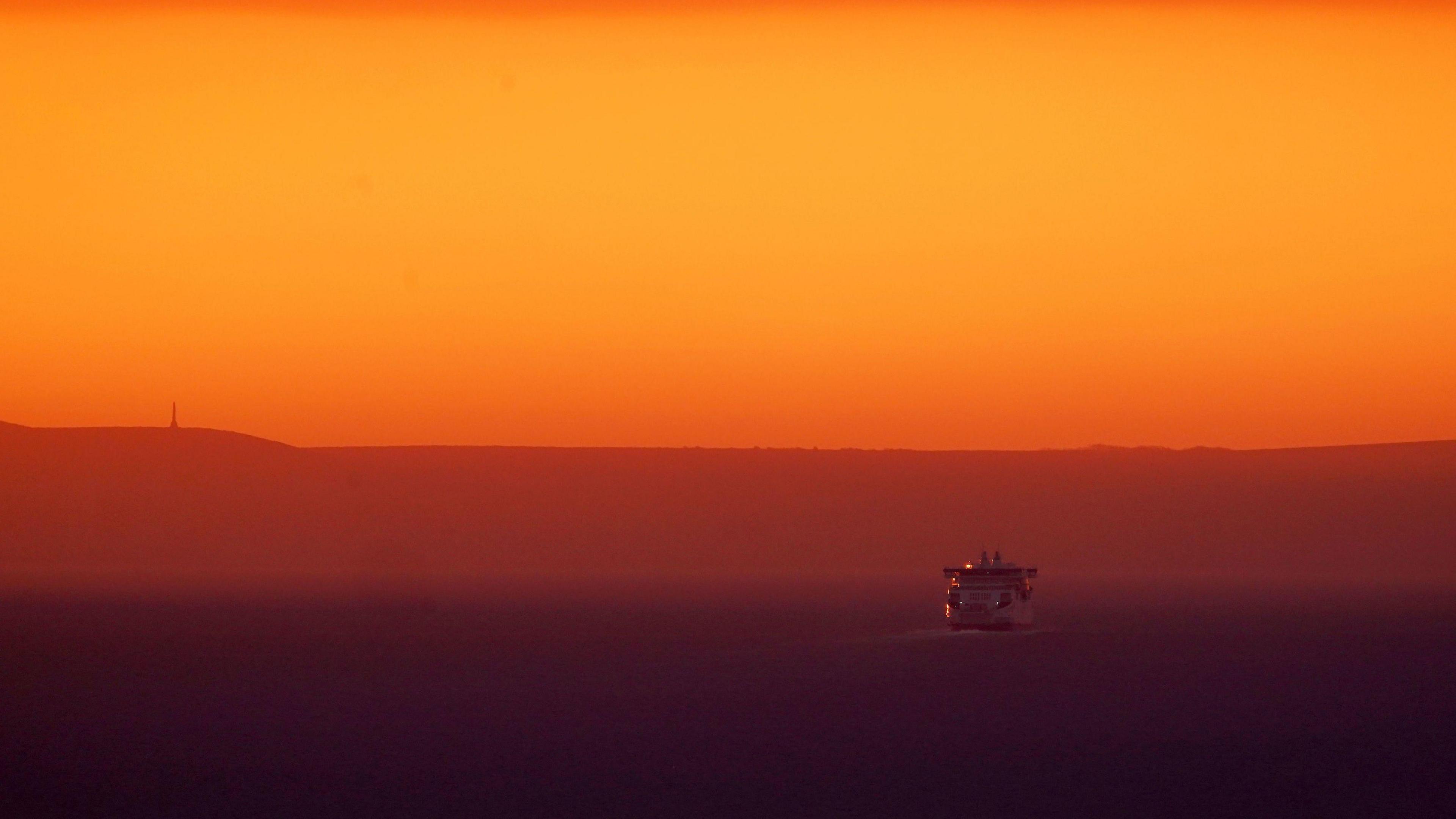 Ferry crosses the Channel towards France at sunrise following warmest February on record