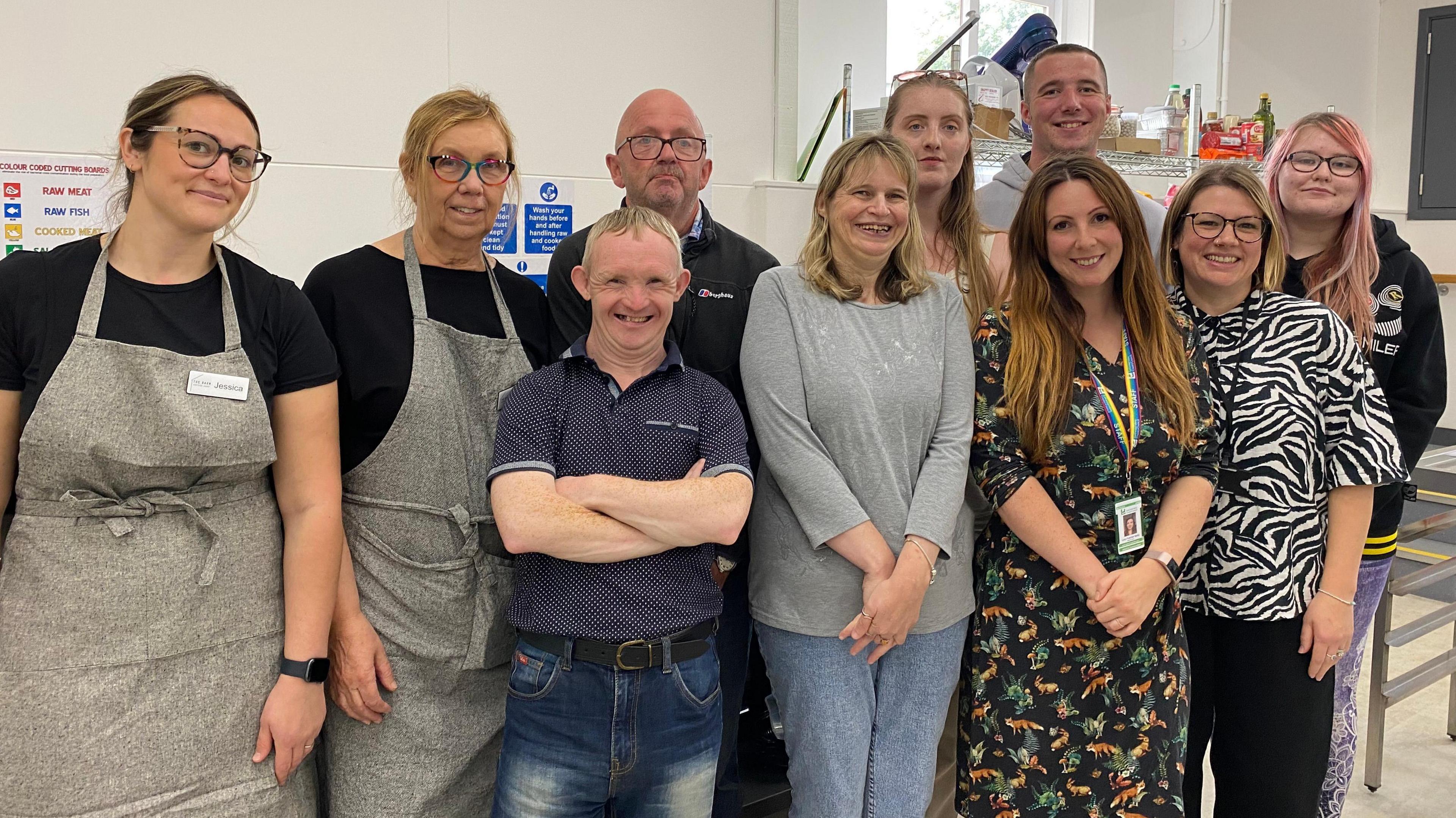 Ten members of the Train 2 Work programme are pictured in a group shot