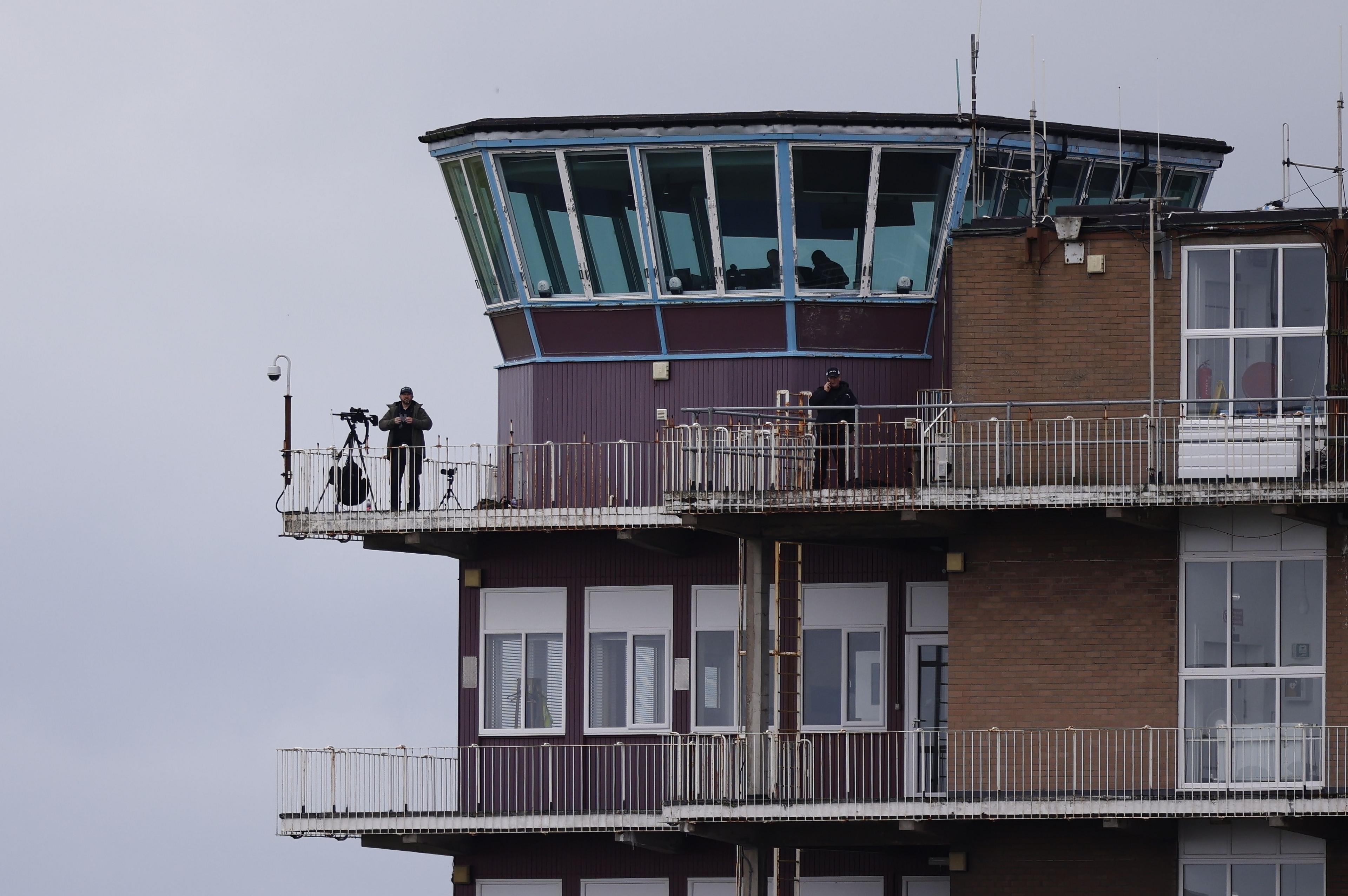 A sniper at on a tower at Prestwick Airport