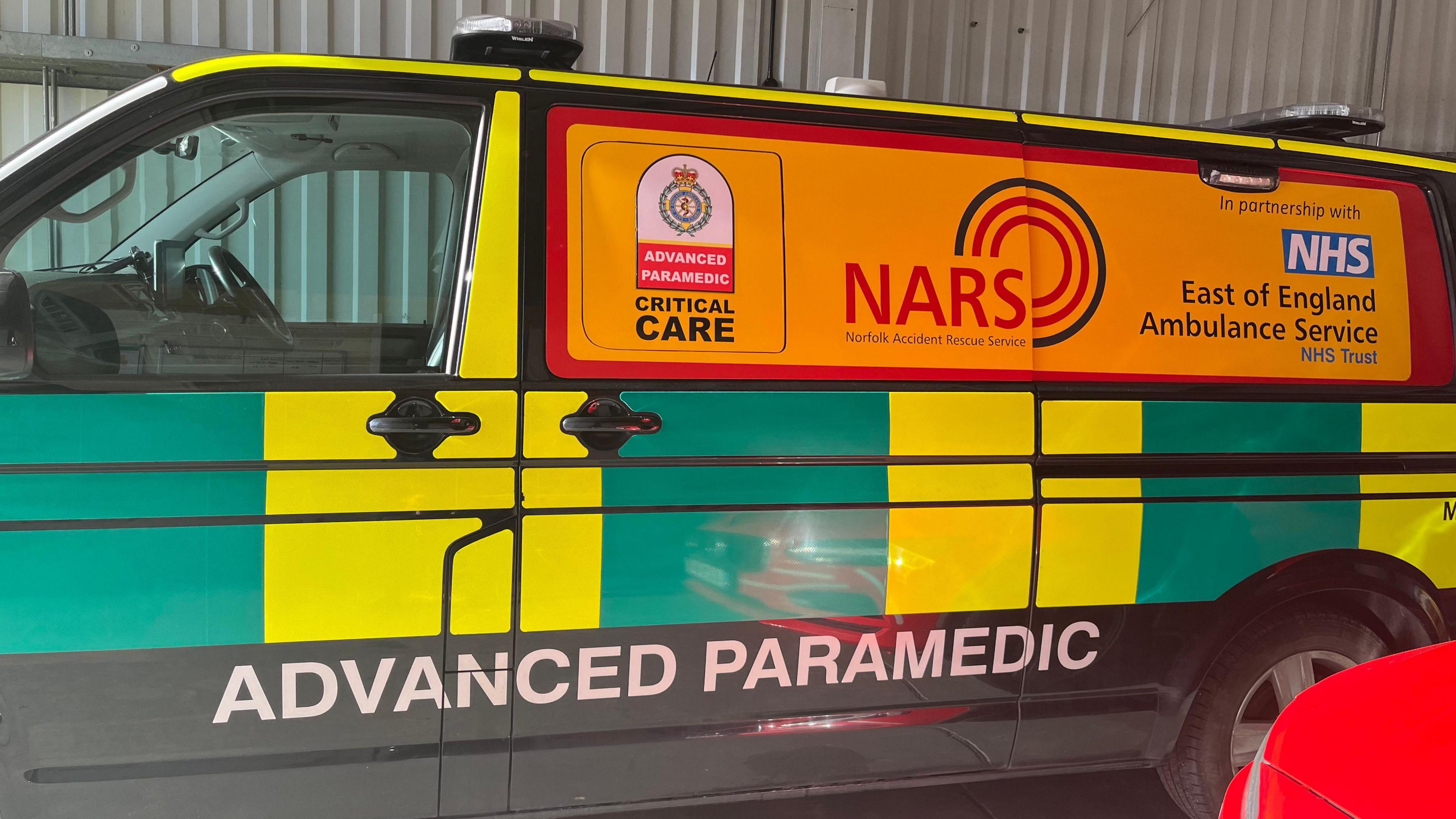 A yellow and green advanced paramedic van with NARS logo on the side.