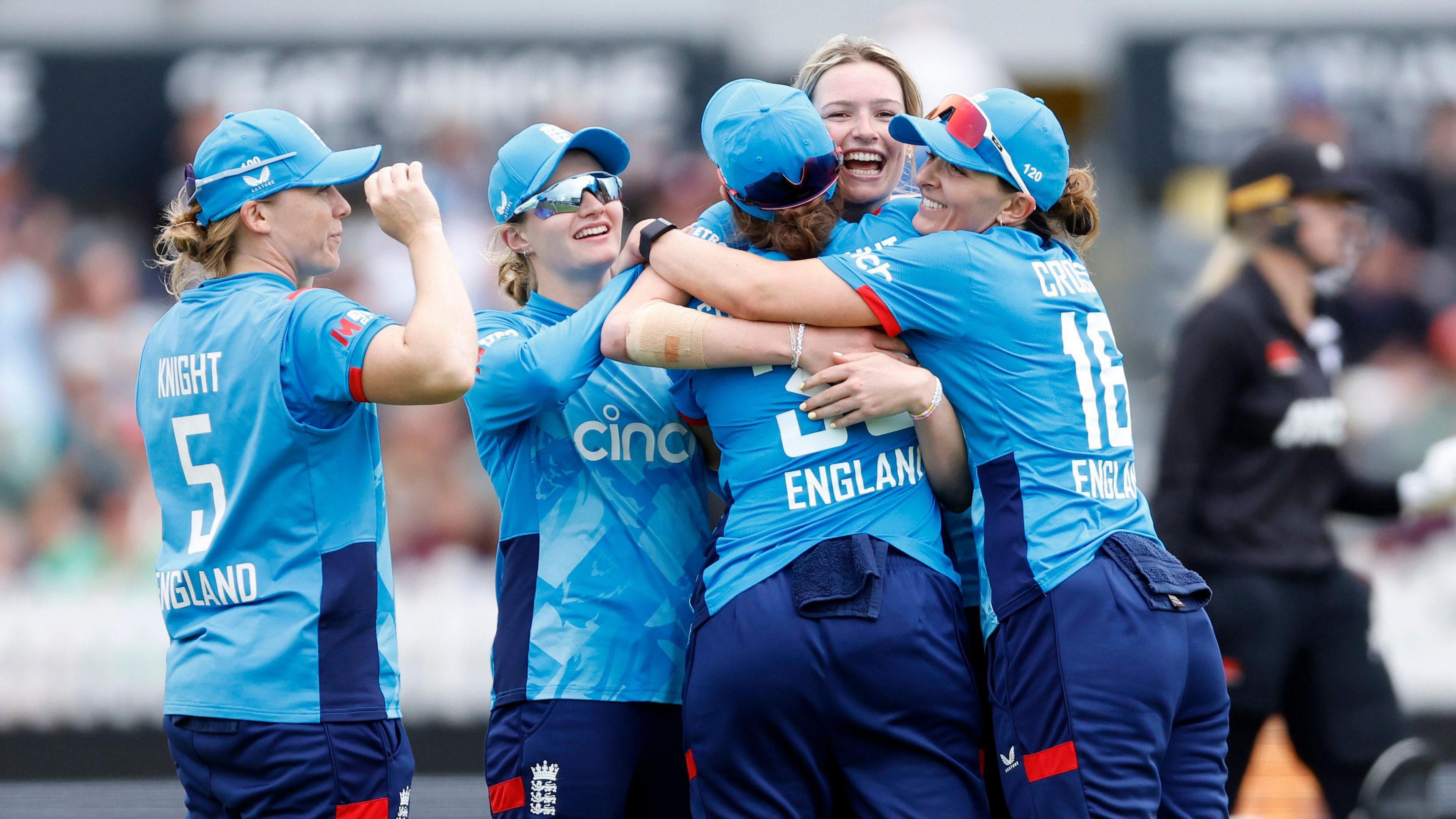 Women's England Team hugging at their match against New Zealand